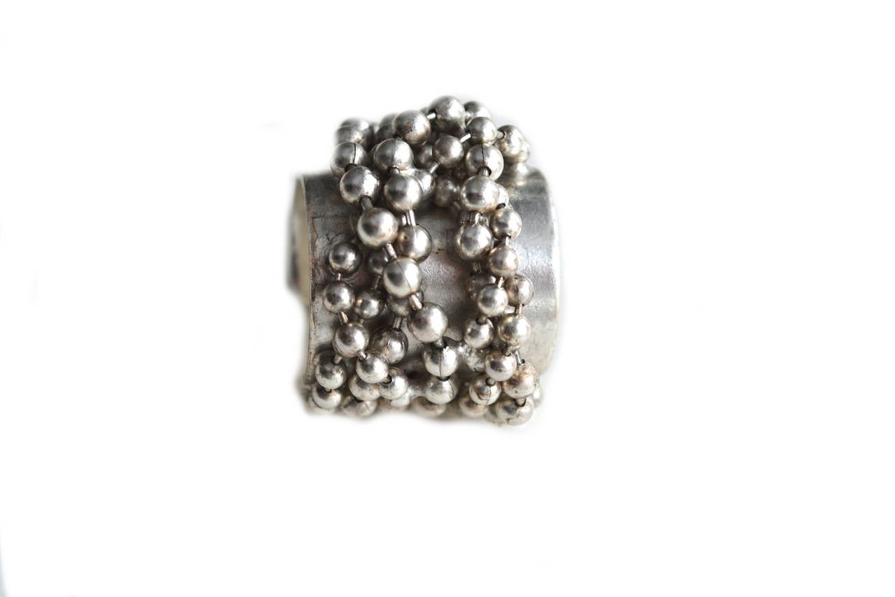 Signed Gaultier silver toned metal ball ring with a punk modern aesthetic. His boundary pushing and sexy fashions in the 80s-90s era when this ring was made are not easily forgotten. Can be worn on various fingers depending on your ring size, but