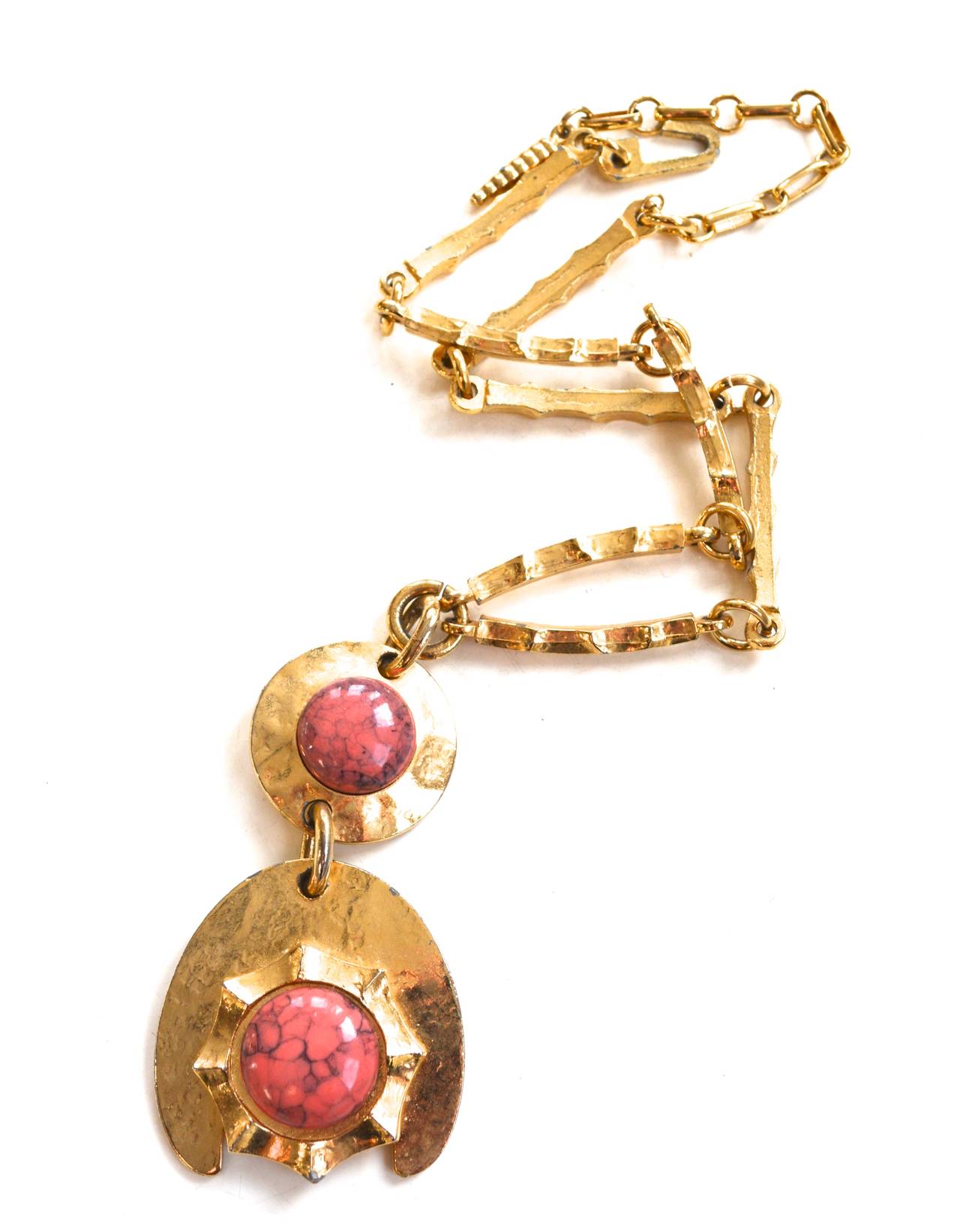 Vintage pink glass cabochon and golden metal abstract signed Hobe necklace. Hook closure and mod links. Somewhat adjustable. Unique overall fashion influenced design. Chain is about 17