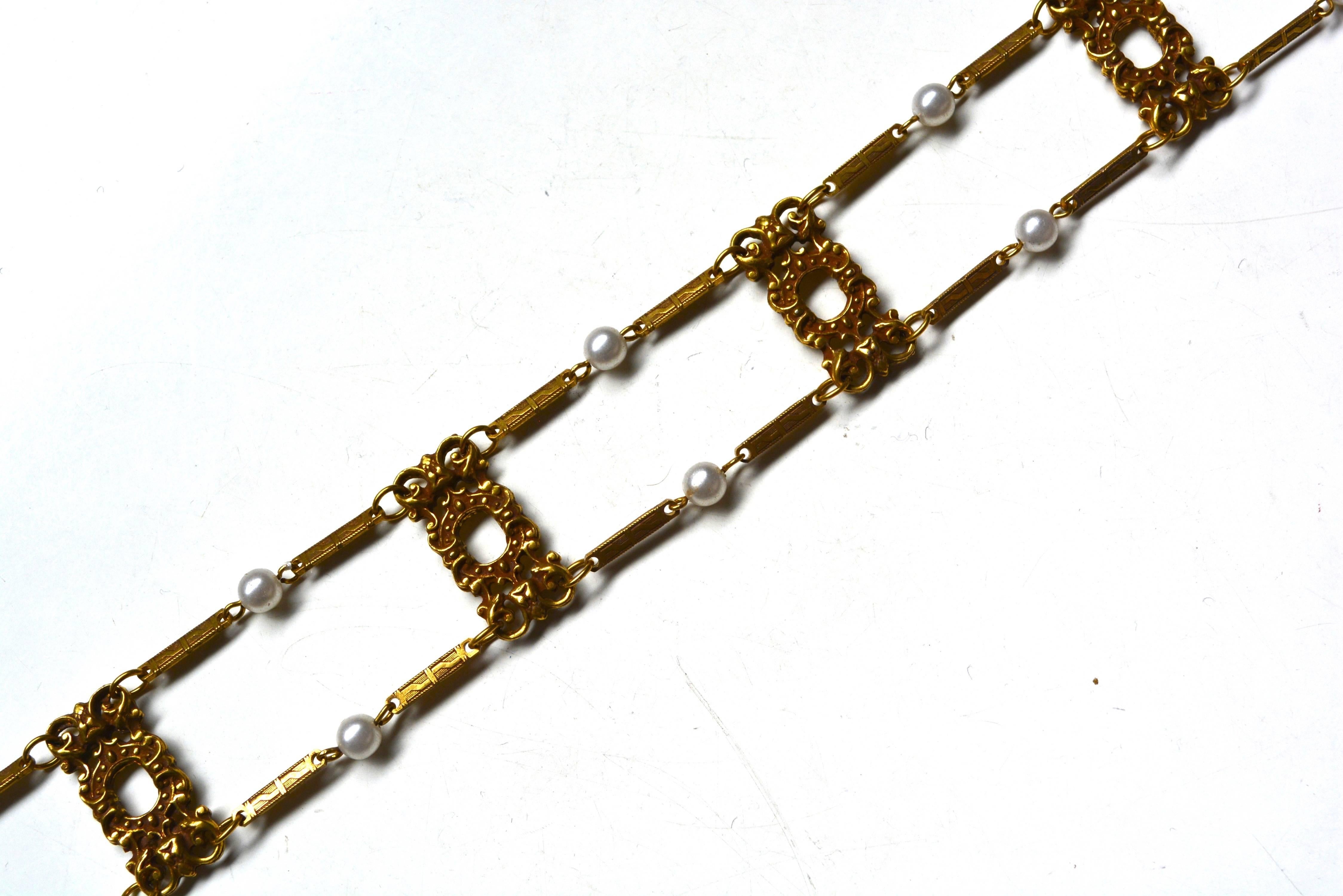 Vintage choker with adjustable hook in back, unsigned. Features a Victorian revival style and detailing.  Circa 1960s.  Adjusts to a max of 15