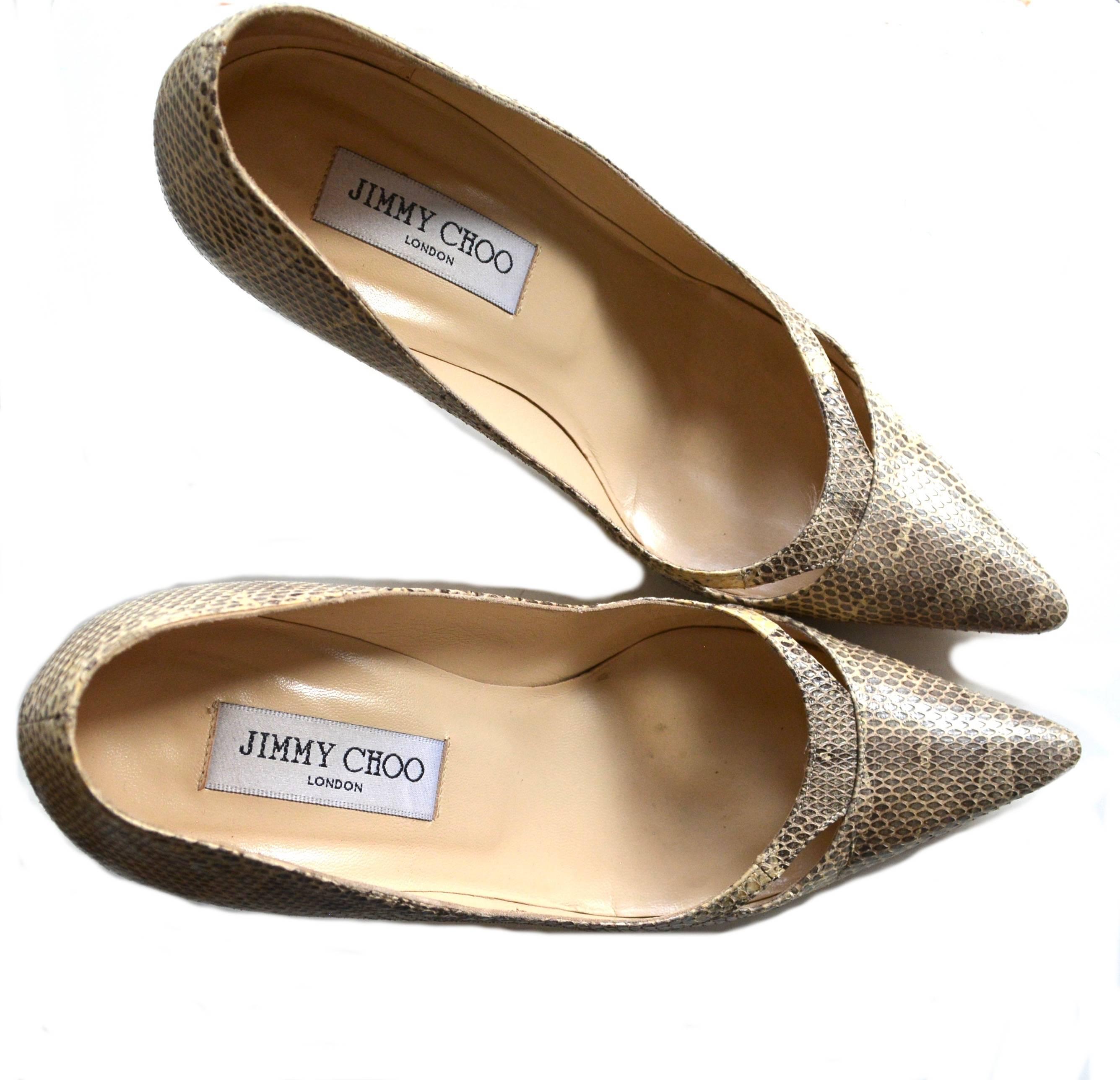 Size 37 1/2 Jimmy Choo snake skin heels in a great neutral palette. Condition is very good with wear to the sole. 