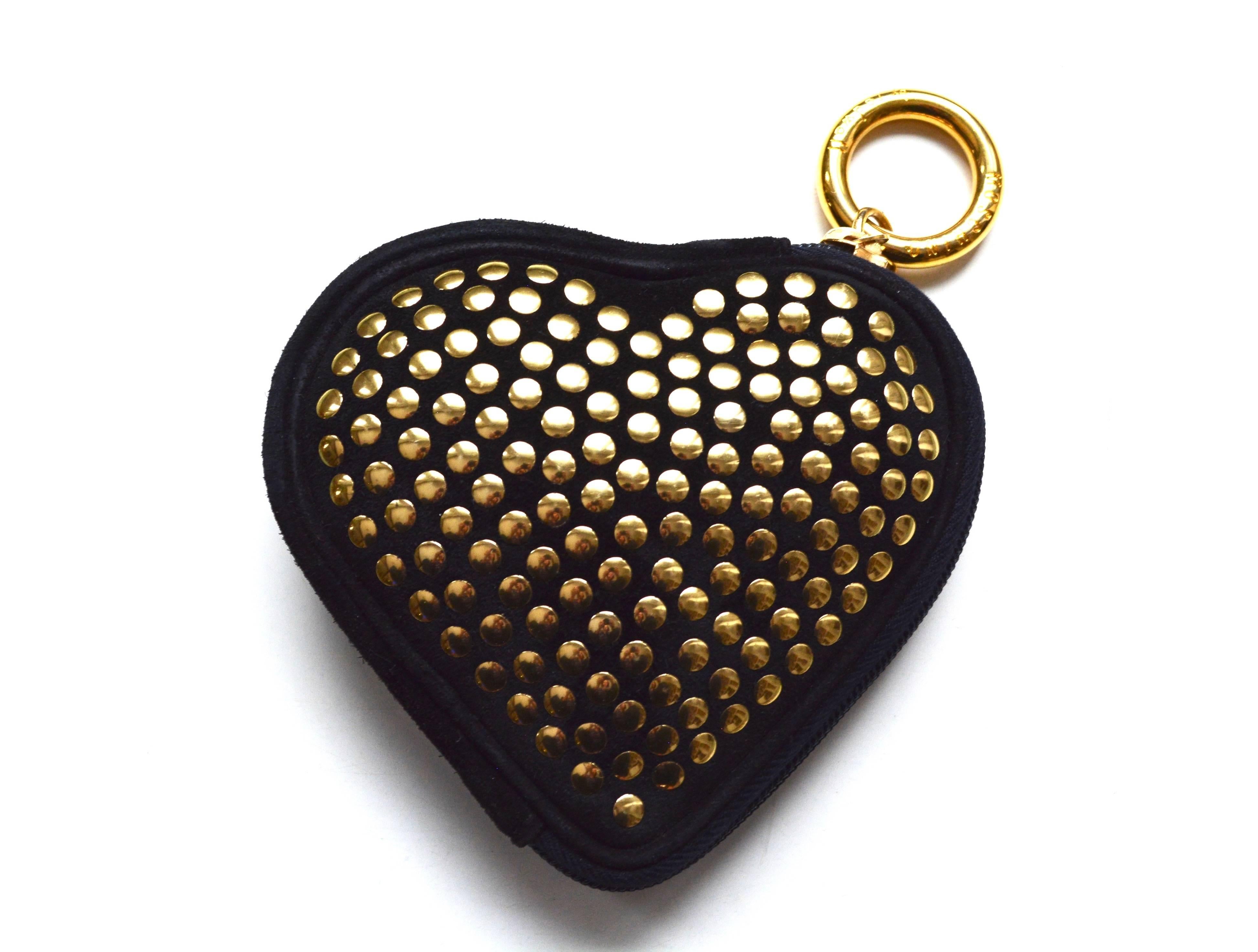 Flat studded black suede flat studded heart wallet.  Signed Moschino by Redial on the circular hook. 5.5