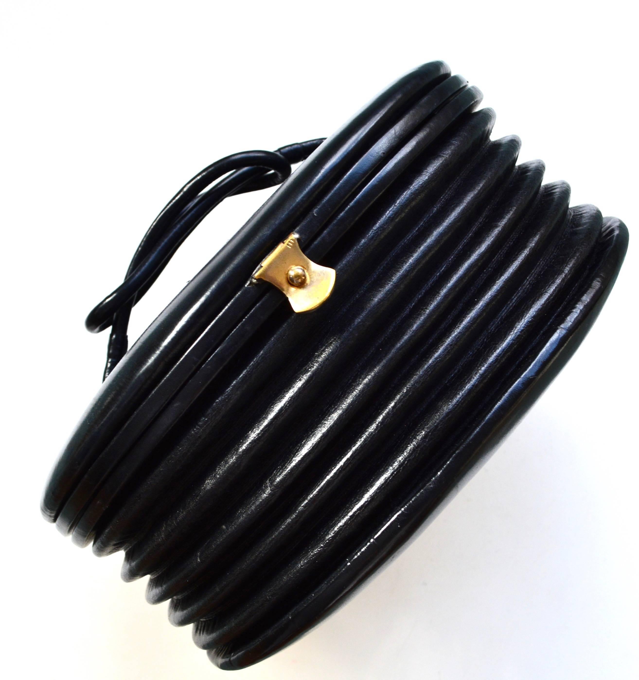Roger Model for Josef made in France black leather accordion handbag. Very good condition with some wear to the top, most notable on thin scratch see image. Leather is soft and in good condition overall. Clean red leather lining. Circa 1940s. About