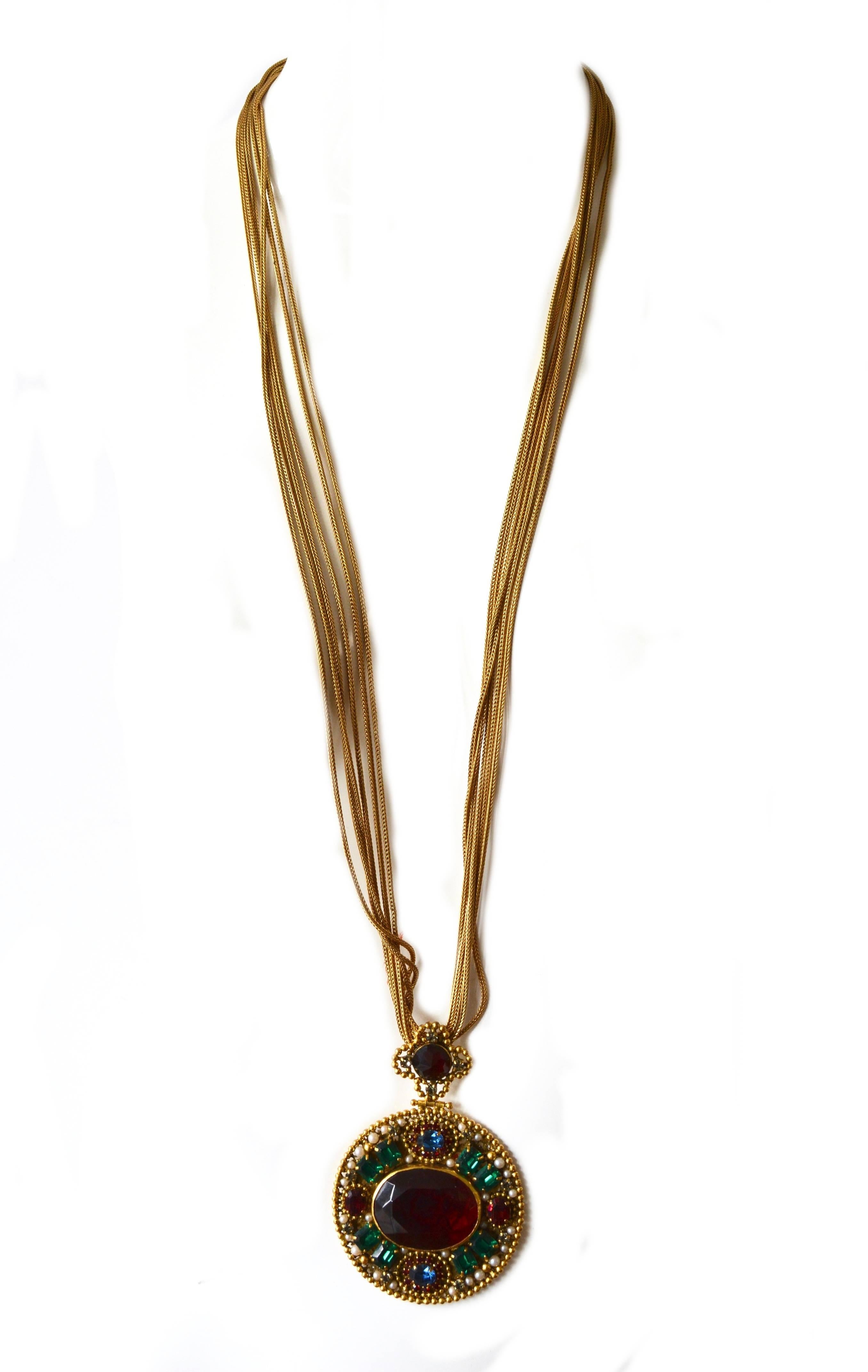 This very special rare piece comes from the private collection of a former employee of YSL.  A similar necklace was sold in the Anna Miller auction, this collection also featured that piece as well. Here, this version features glass stones and gilt