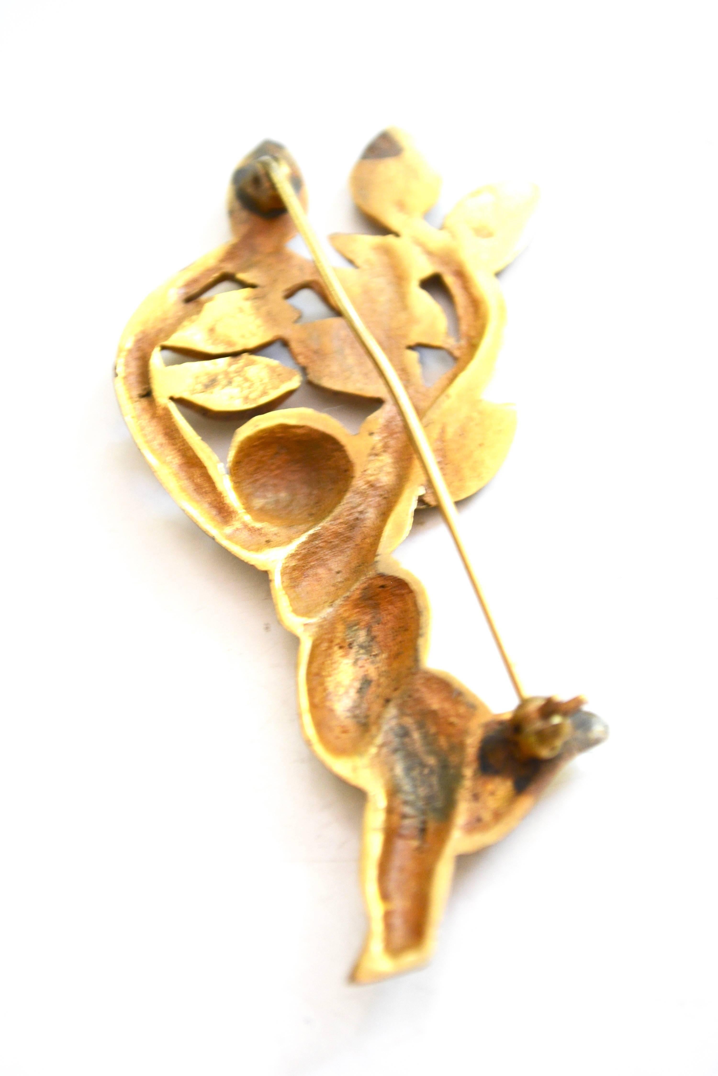 Signed LV gilt whimsical dancing figure becoming a tree. The arms are branching out with leaves.  A bit over 3" long. Width varies from 1.25". Rare and demonstrative of her gilding. Circa 1940s-50s.