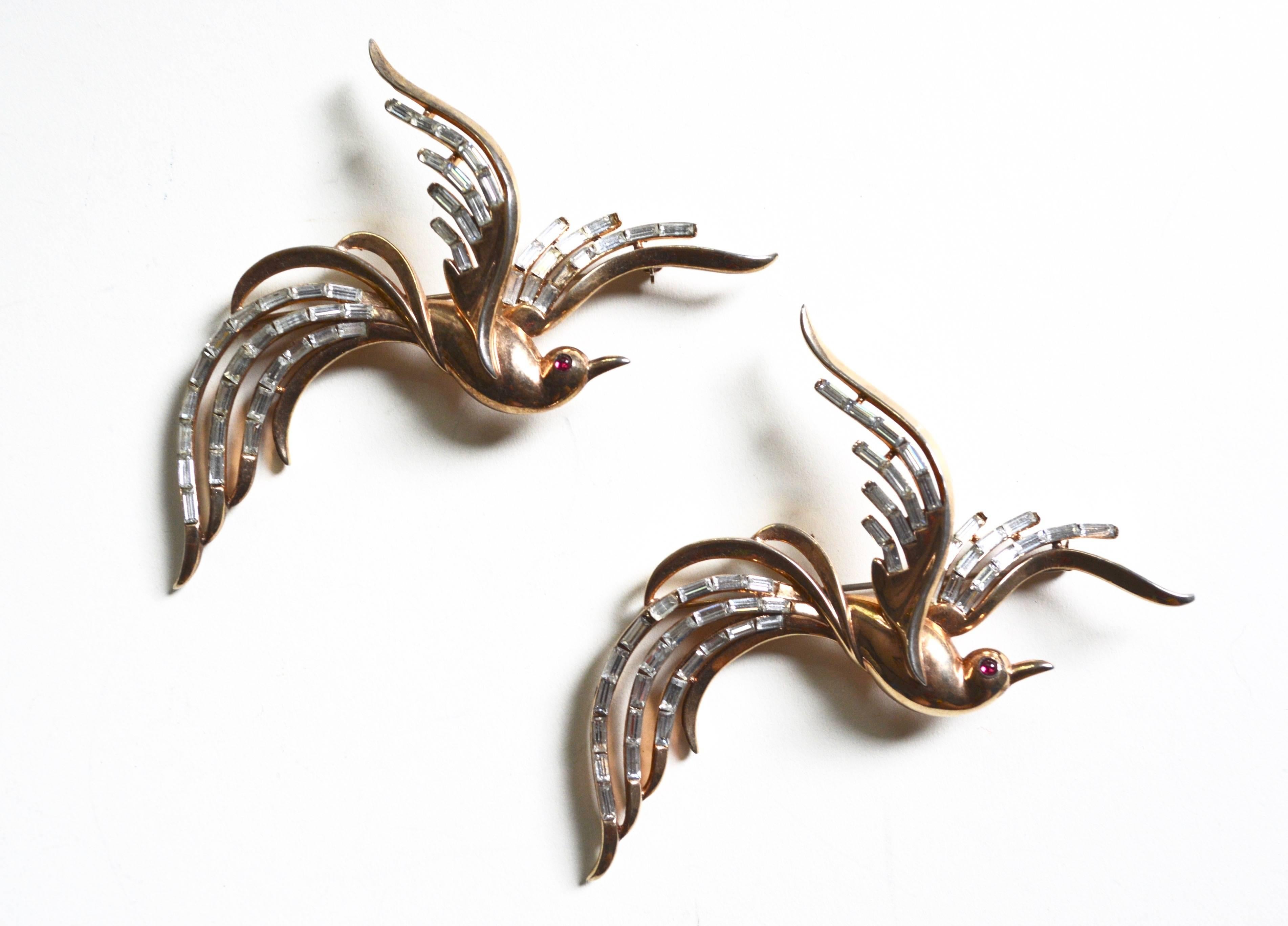 Large sterling marked Trifari Alfred Phillippe Bird of Paradise brooches. Patent granted in 1950. Wonderful movement and rarer set. Condition is very good, minimal overall wear. Each one measures 4"l x 2.5".