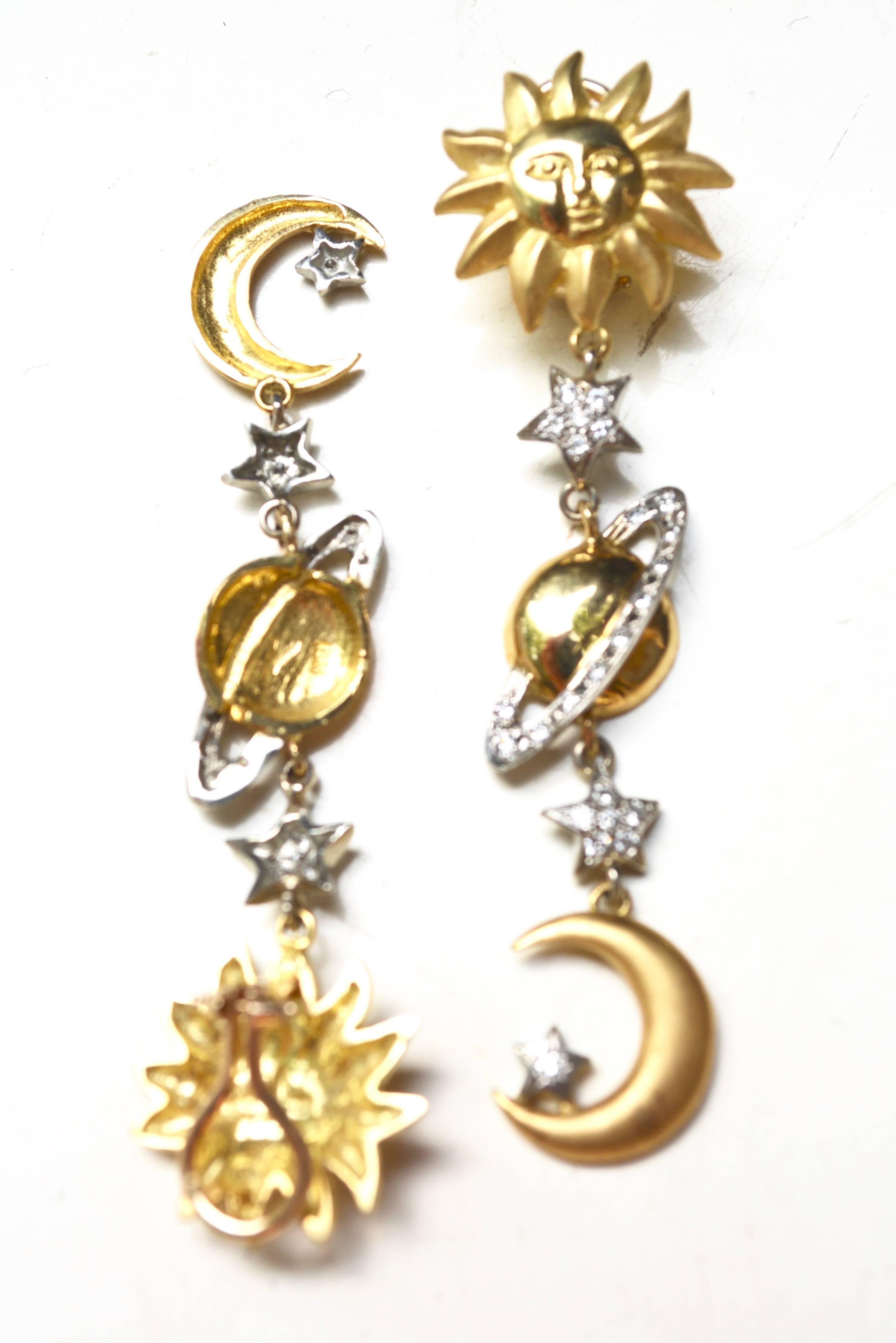 Circa 1980s marked 18k gold sun and moon (solar system) earrings. Unique and fun design. Platinum details. About 18 grams. Not overly heavy on the ear. 3" long.