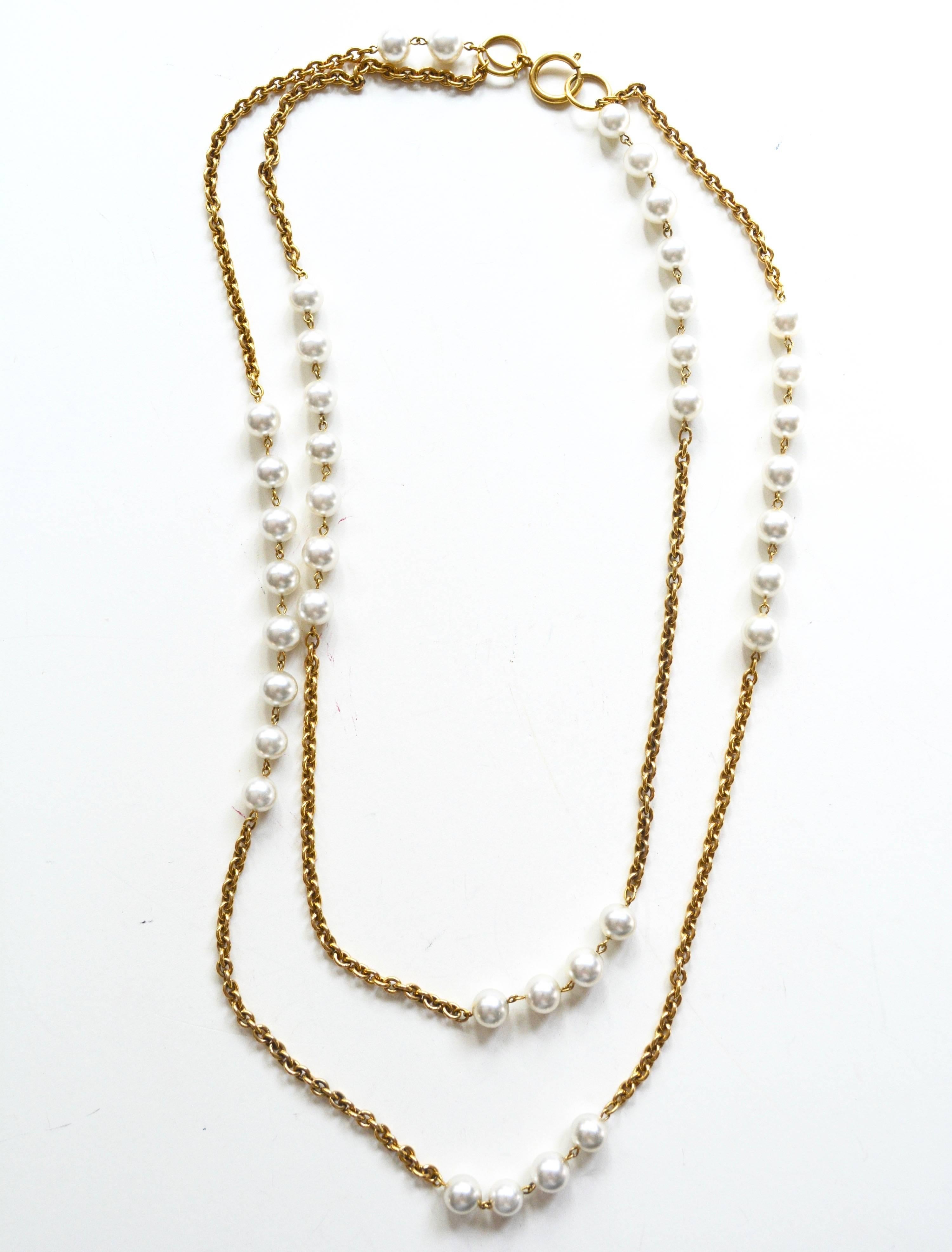 Early 1980s pearl and gilt multi strand Chanel necklace, signed. Marked with no date indicate an early 80s or late 70s era. Condition is excellent. Shortest chain is about 26