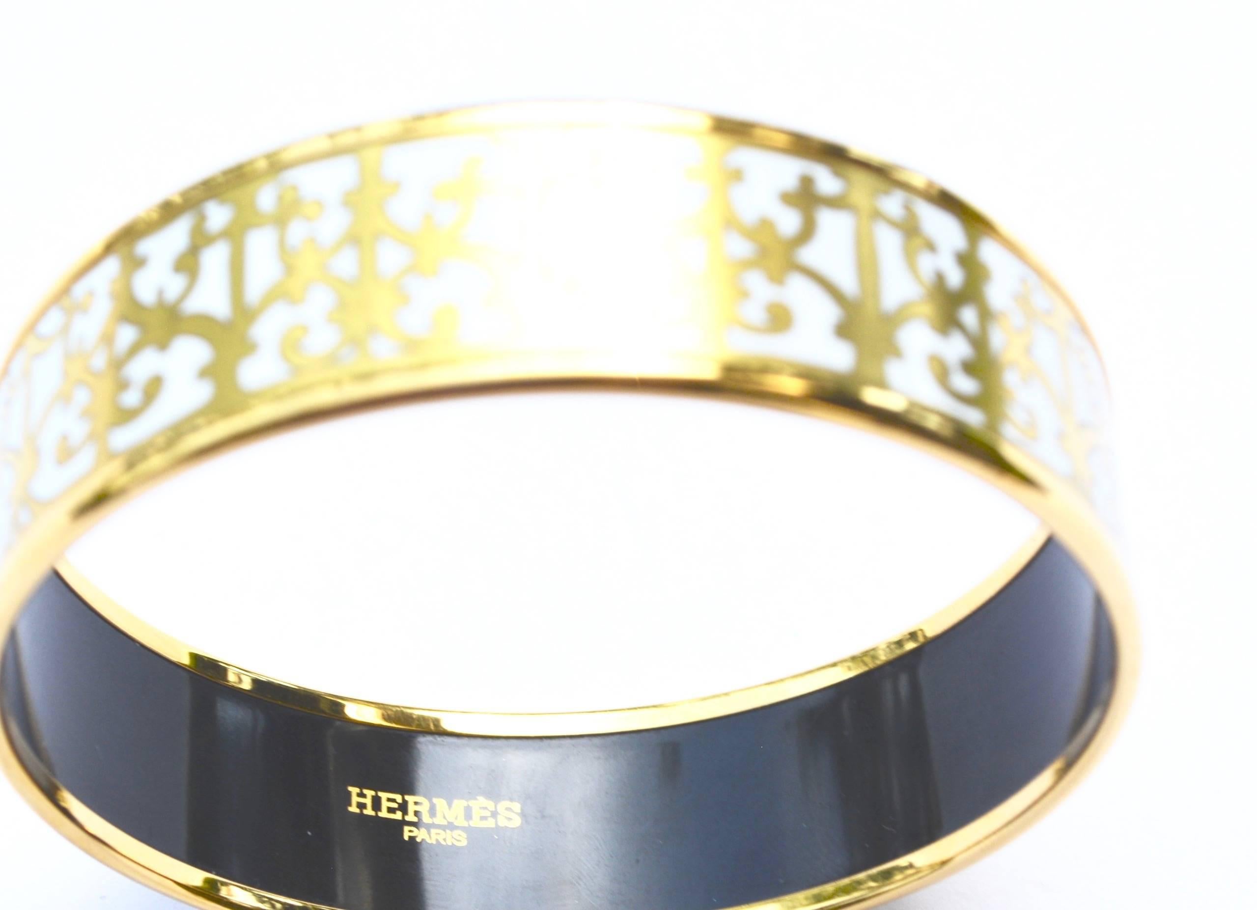 Hermes signed made in France enamel bracelet. Gilding and enamel is excellent. 7.5