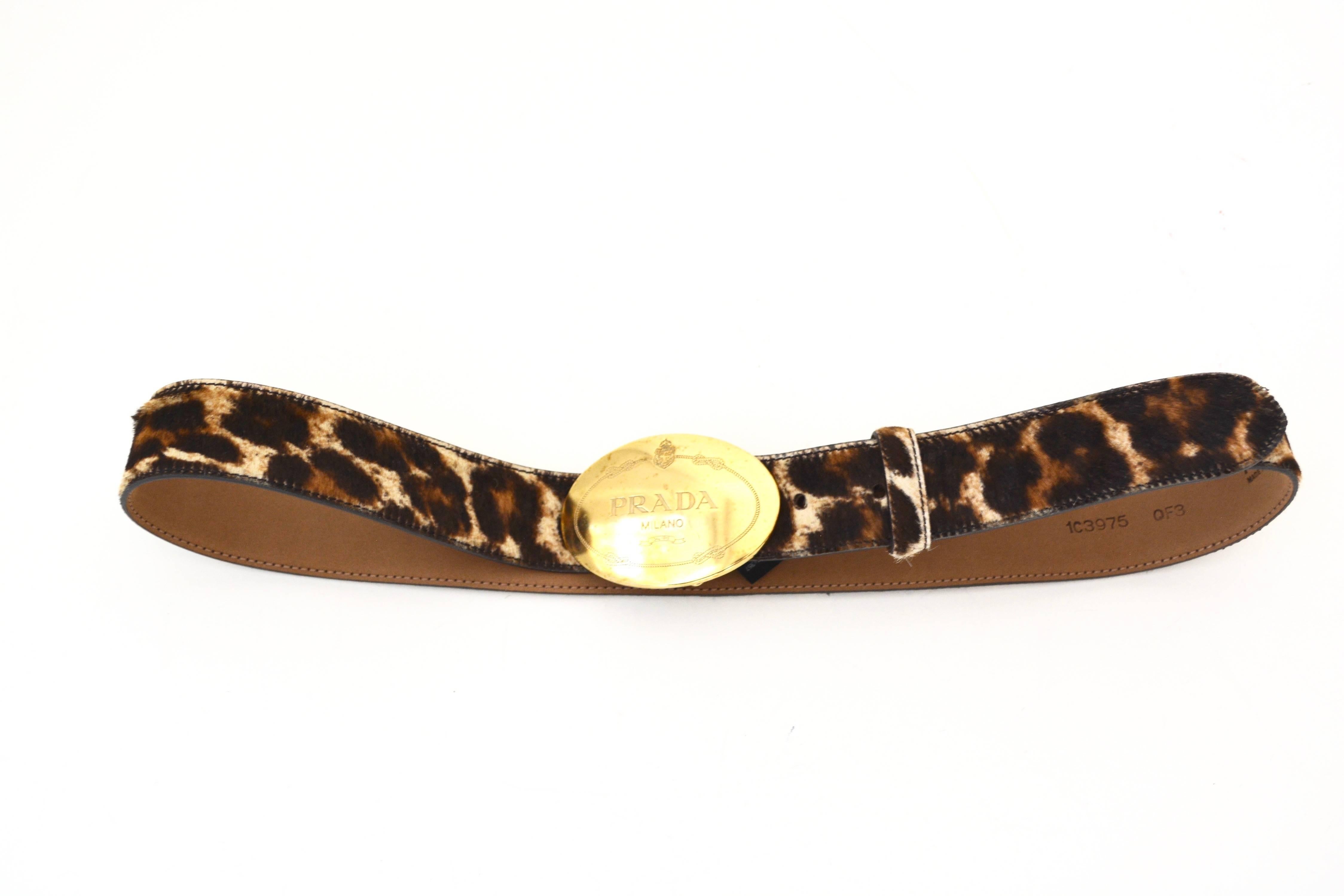 Prada cowhide hair style leather belt with a leopard print. Good condition with minor discoloration spots to the buckle. 34, Made in Italy. 