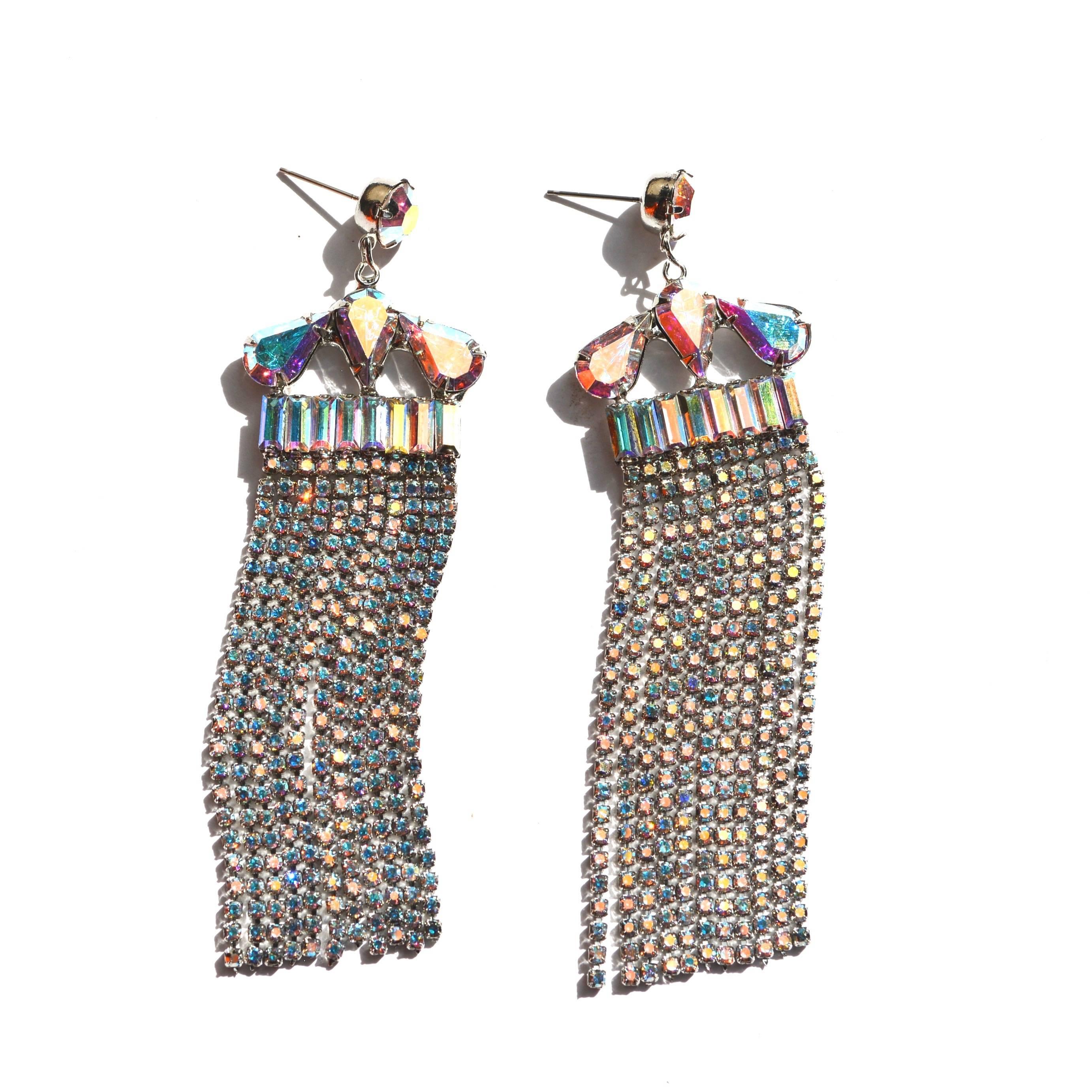 Rhinestone Swarovski rocker fringe earrings. Rhodium plated. From our new earring collection. Made in the USA by hand. We use Swarovski crystal.  4″ length. Part of a new line of jewelry based on our studies of theater, showgirl, and modern design.