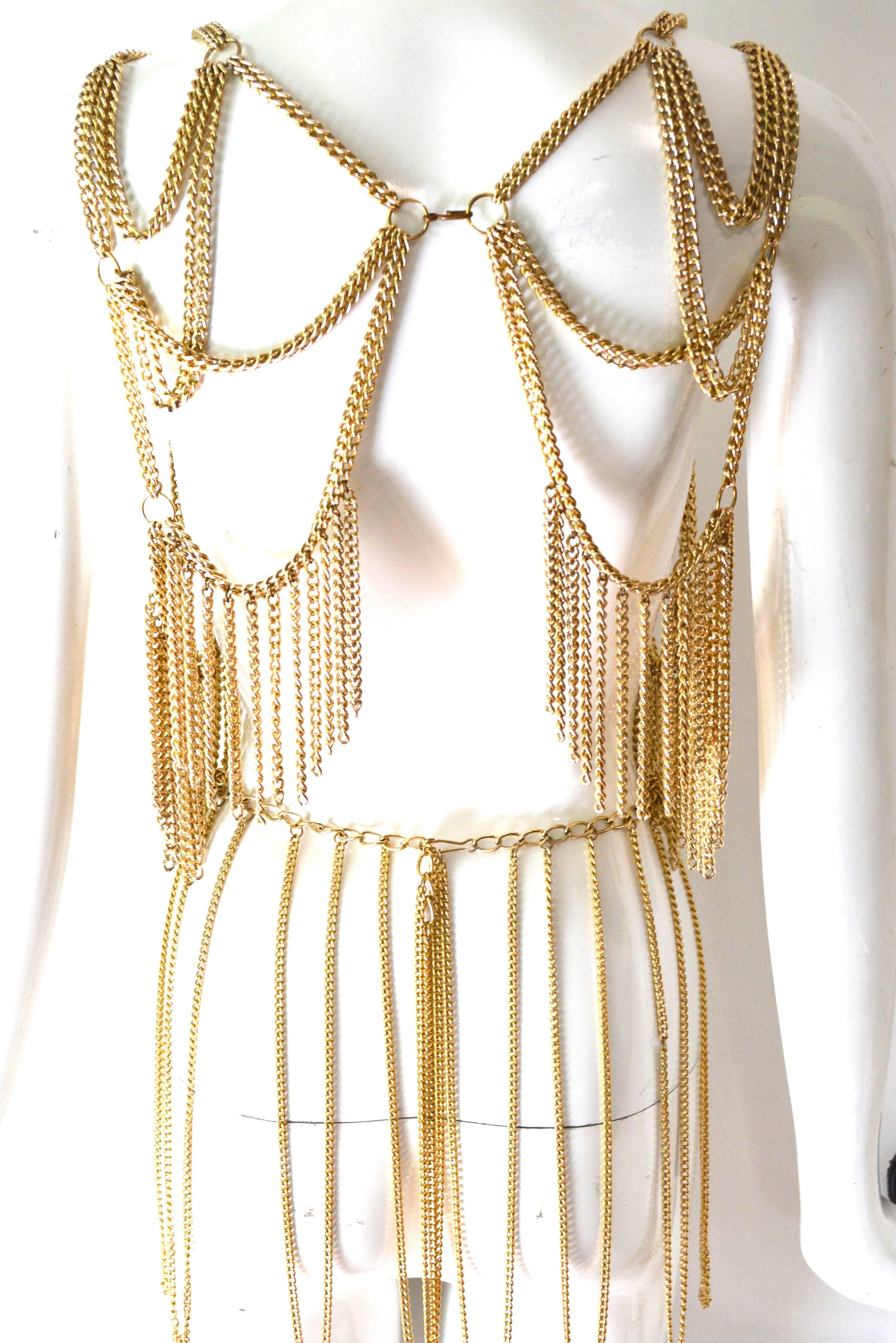1960s showgirl fringe metal top and belt set, unsigned. Has older clasp styles and lighter 60s chain.  Rare duo to find, excellent condition with some tarnish to hooks and rings. Top fits about an S-M. Could be adjusted with the addition of chain in