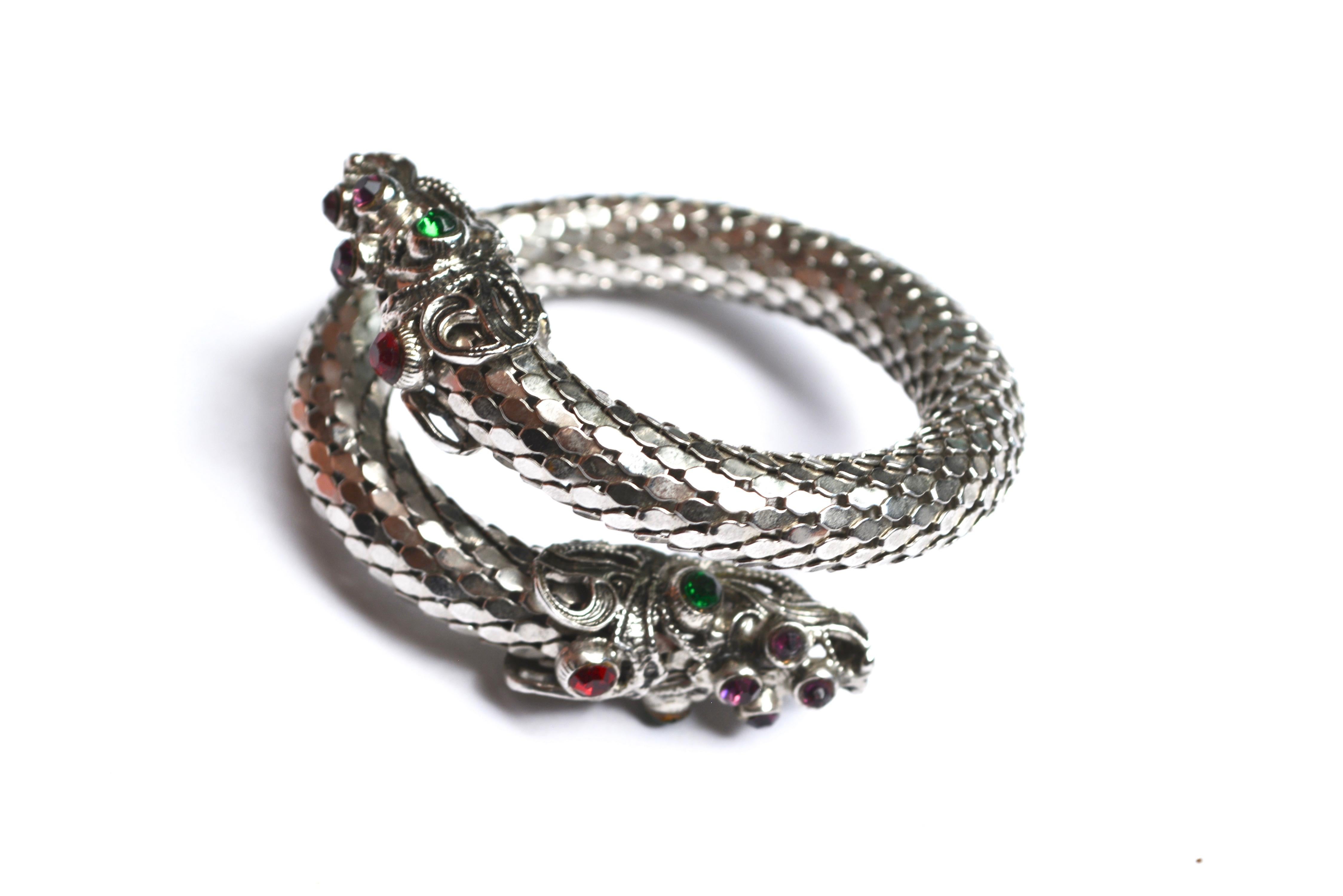 Unsigned Whiting and Davis style mesh bracelet, adjustable. Dragon heads are well preserved. 