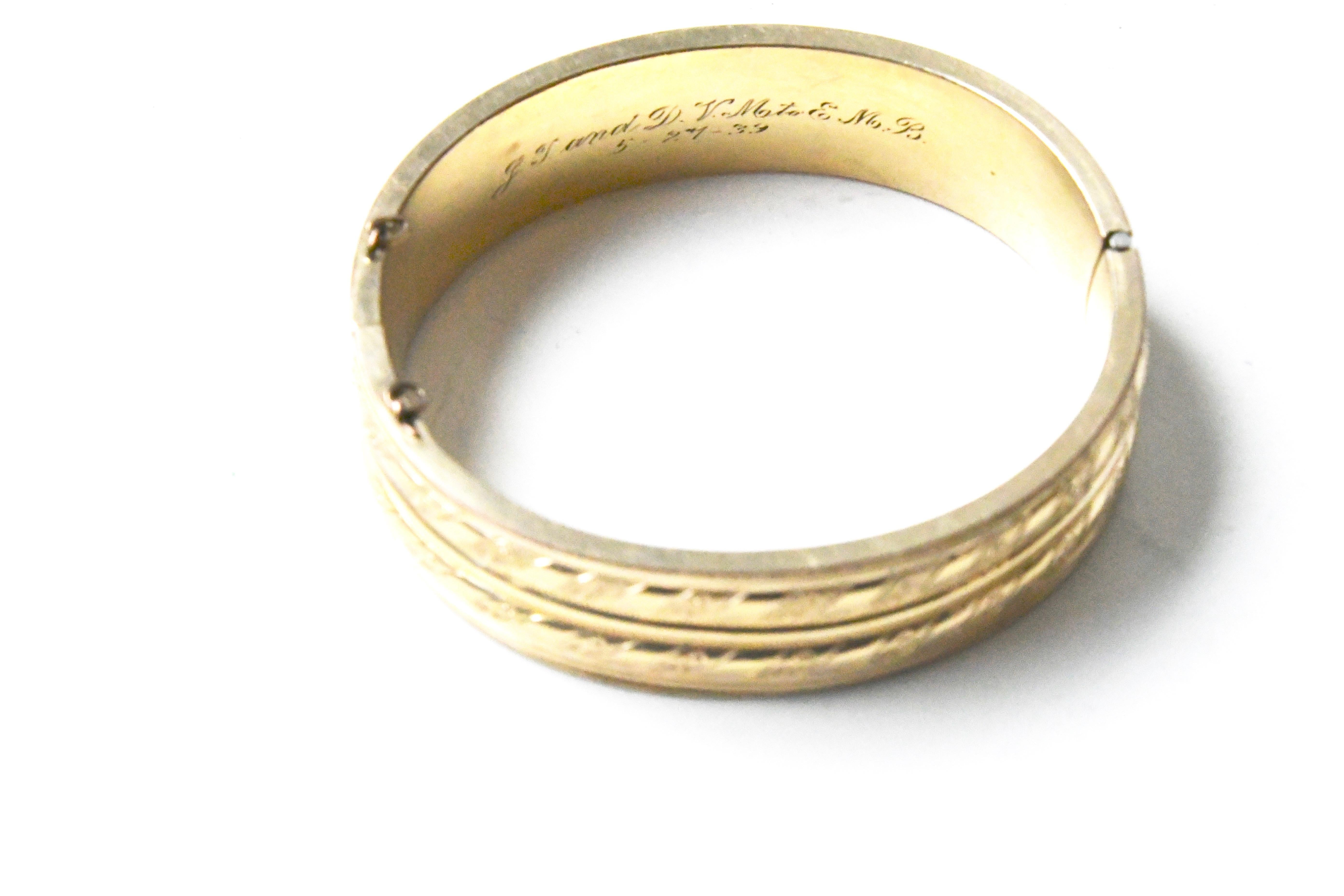 Inscribed antique vermeil bangle with scrolling and stripe details. Missing the original safety chain. Inscribed 39, probably 1839.  Marked inside appears to say 20 and 10K.  Clasp is working well. About .6