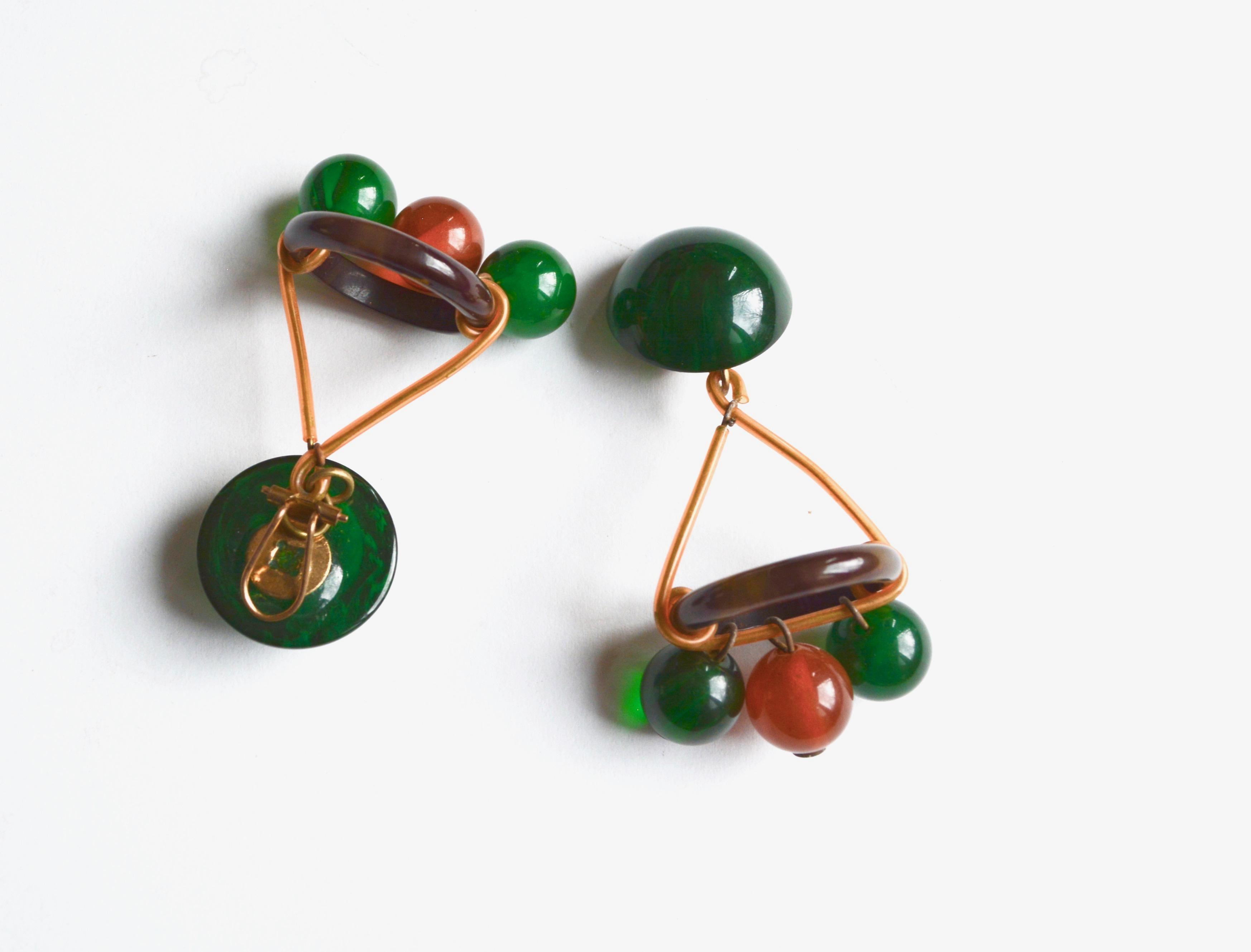 All original Bakelite circa 1930s earrings. Unmarked, but the clasp style is more European in construction. Measure 2.5