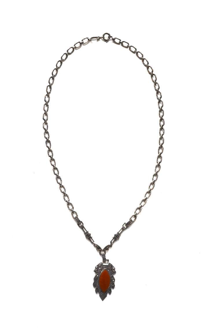1920s delicately designed and marked sterling marcasite and carnelian art deco design necklace. Pendant is about 1.25
