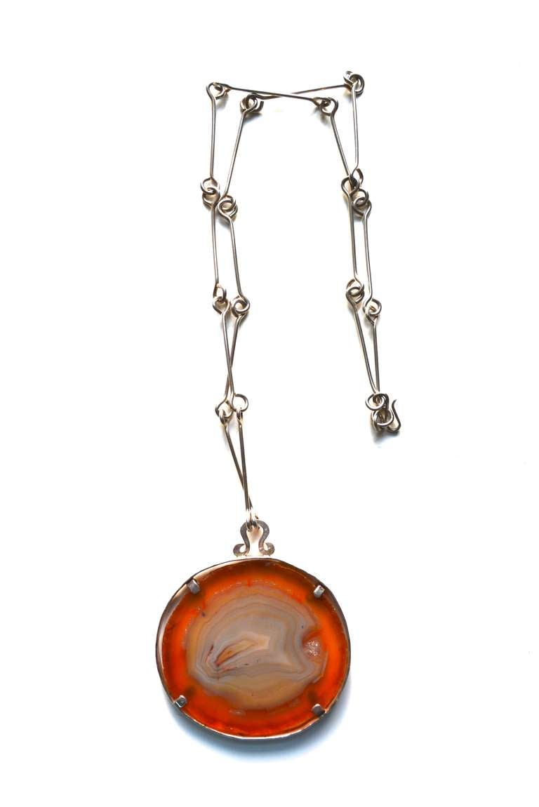 Oversized sterling modernist agate slice necklace. Unsigned. Piece is handmade and dates to the 1960s-70s.  The colors are rich and the agate is in excellent condition.  Pendant is 2