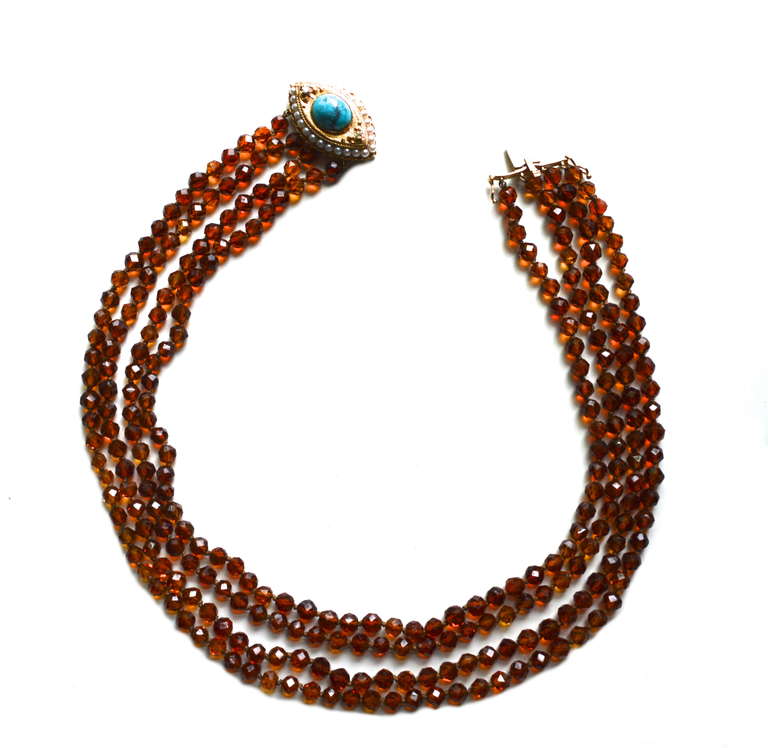 Finely cut 230 count knotted quartz bead necklace.  Beads are joined by a stunning 14k gold navette cabochon turquoise, diamond, and cultured pearl clasp. Unmarked, but I believe it is European in origin. 63.8 grams. The clasp can be worn to the