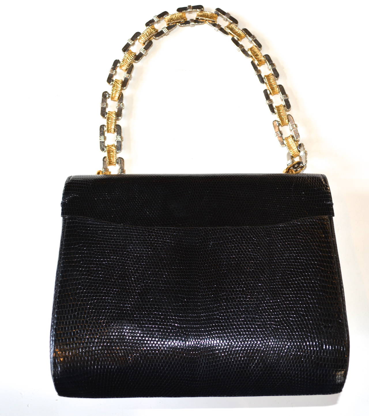 Mid century exotic leather- I believe it is lizard skin, Cerny Paris bejeweled bag. Quality construction and fine detailing, signed. This bag is in fabulous condition kept in the same family since it was purchased.  The paste stone and golden metal