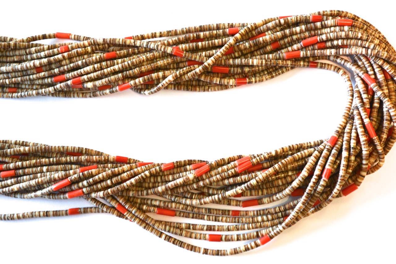 Coral and shell heishi necklace by Angie Reano Owen, a renowned Santo Domingo Pueblo artist.  The former owner purchased it in a gallery. The collection that this piece came from has been photographed, according to the former owner, for important