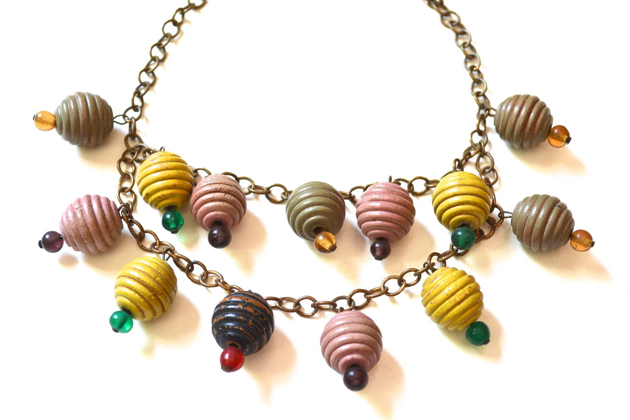 Art deco era wooden pastel painted charm style bead necklace with glass accents.  Possibly unsigned Haskell. Miriam Haskell and Frank Hess used wooden beads and charm style designs during this early era. Lovely whimsical pastel colors.  The width