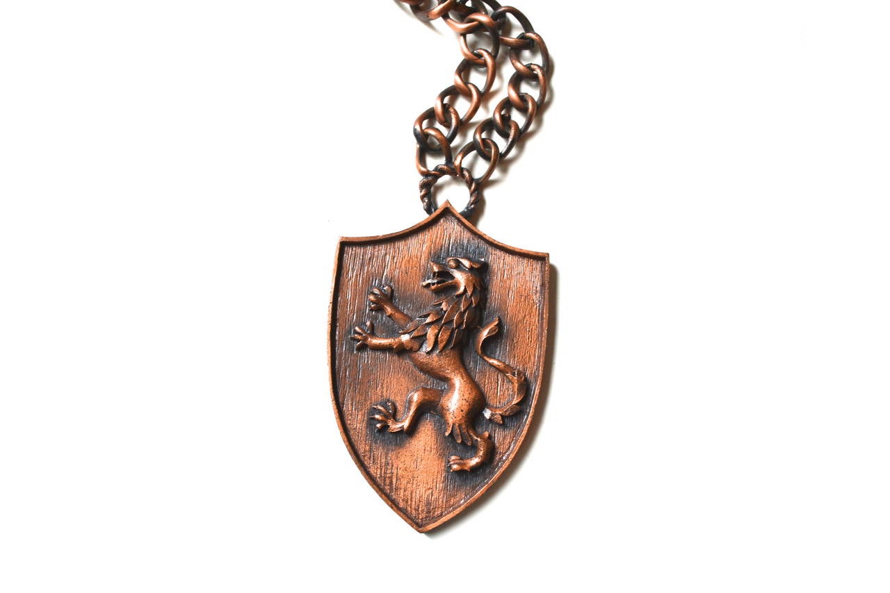 Regal oversized copper signed Trifari lion shield style necklace with a chunky longer chain.  The pendant measures 2