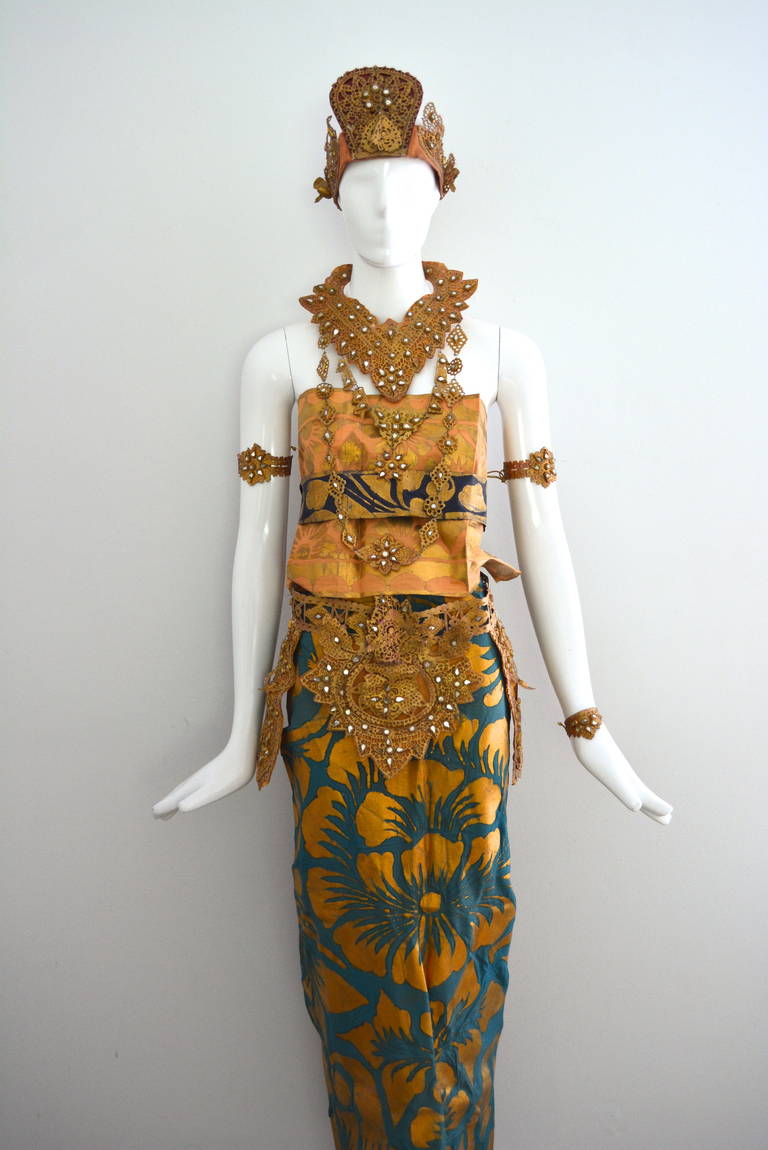 Traditional vintage Balinese gilt and leather dance outfit. From a family costume collection. The head piece is very wearable along with the various gilt mixed leather and glass bead accessories. The belt and four bracelets/ankle bracelets tie