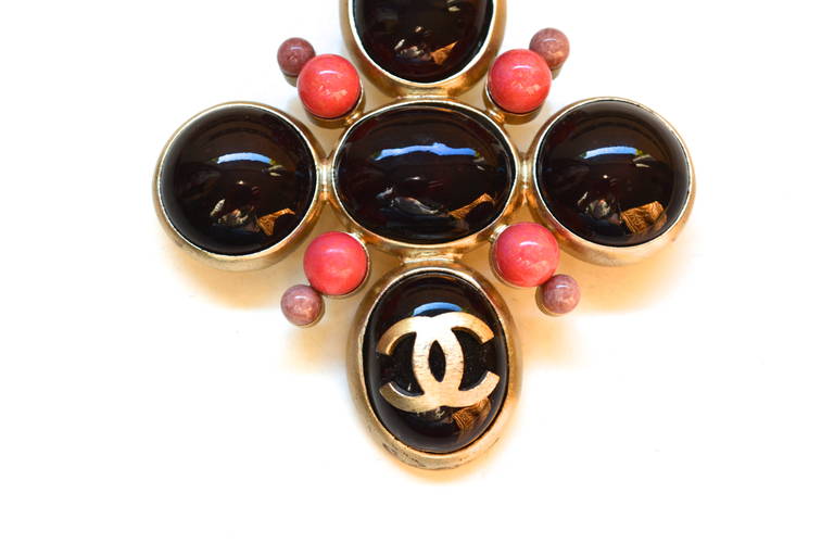 Stunning rarer brushed silver tone metal Chanel brooch. Features deep burgundy, coral, and lilac Gripoix glass cabochons and the CC logo.  Original dustbag included.  Signed on the back and dated 04.