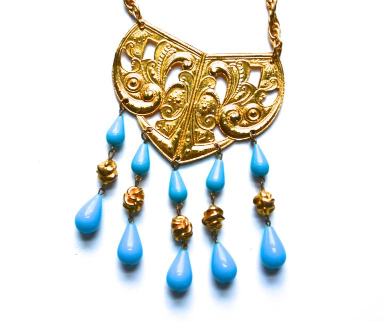 Earlier Kenneth Jay Lane 1970s goldtone metal and turquoise Lucite Etruscan-inspired necklace. Lots of interest and movement due to the fringe style beading.  Signed. Pendant/beading, 3