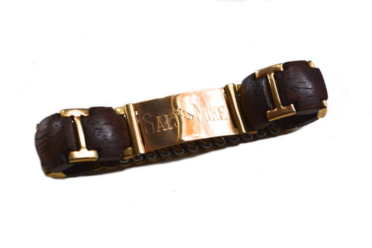 One of a kind engraved men's bracelet featuring natural wooden elements and 10k gold. marked. The piece is truly unique with a rustic yet modern feel. The engraving reads 2 15 54 on the back dating it. Playfully inscribed Sal and Mike, which I love