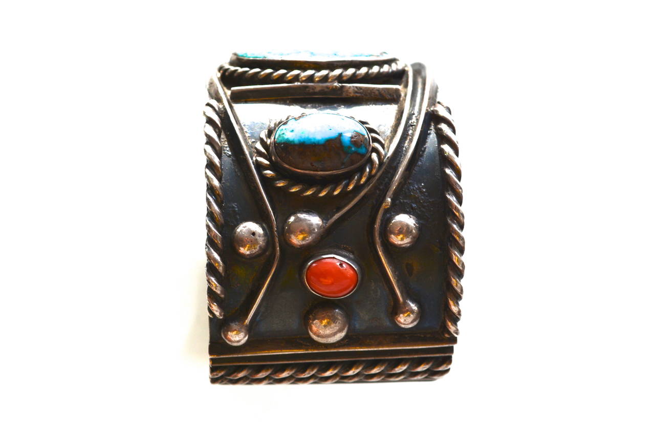 Vintage unsigned/unmarked southwestern silver sterling with possibly some coin silver. It’s a great older piece and has a wonderful graphic design, featuring coral and quality North American turquoise stones. The colors are vibrant. Since it is