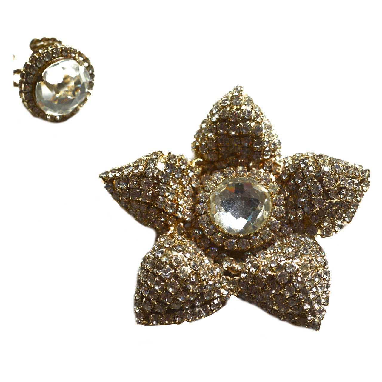 Oversized floral brooch with cut glass accents and rhinestones. Signed. The cocktail ring has a beautiful stone and is adjustable.  Excellent condition. Ring is adjustable. Set at a size 7. Face is 1