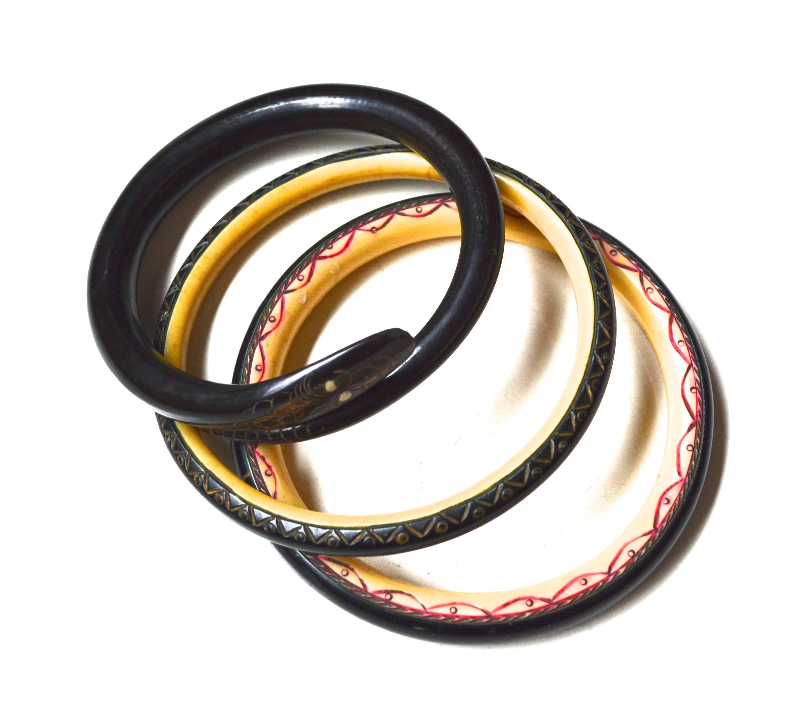 Victorian horn serpent bangle, late 1800s, in a larger wearable size. The second two bangles from the same collection appear to have a scale affect or a continuation of the snake's body. These two could be horn and celluloid from a bit later or 20s