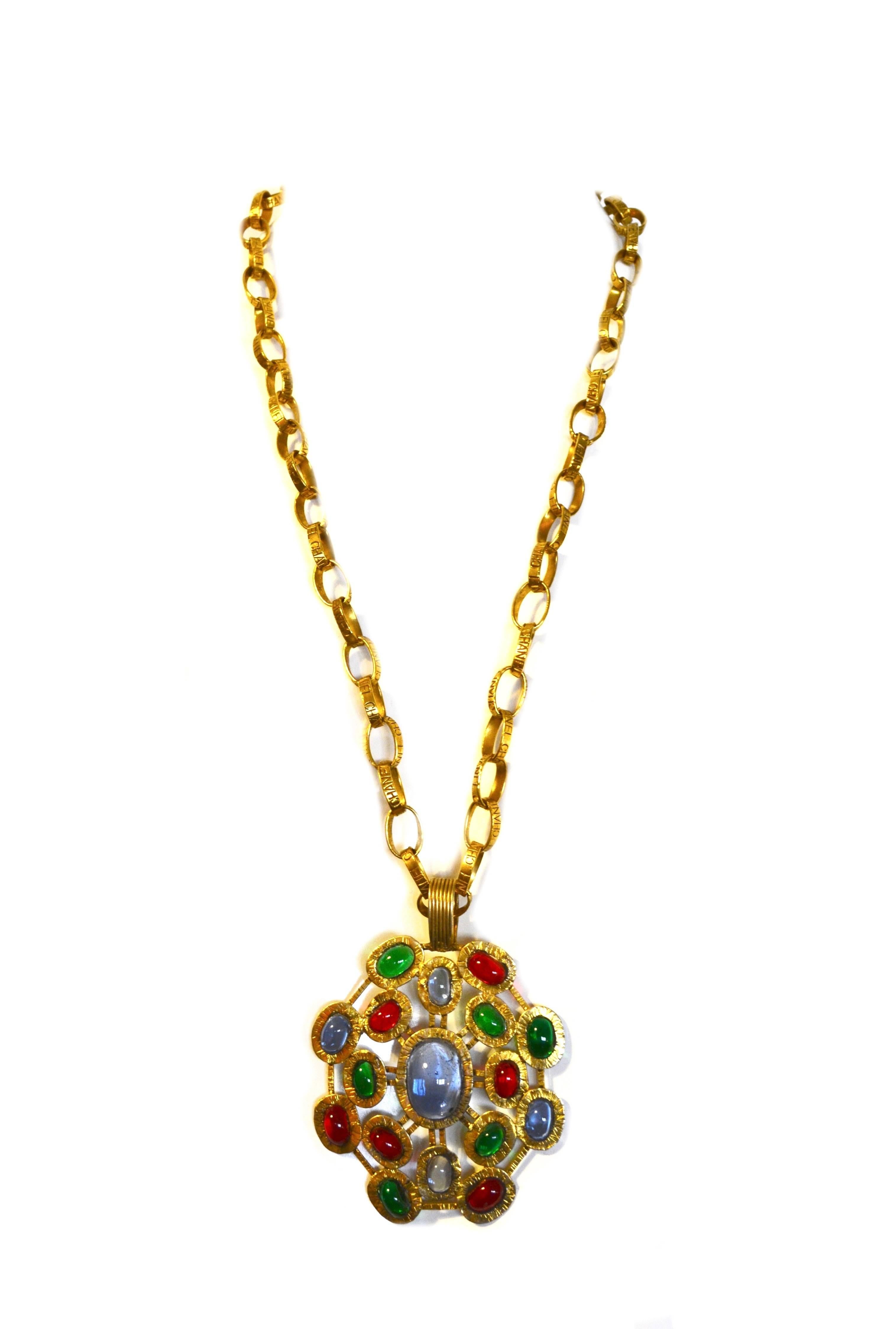 Unique Chanel stamped chain link necklace with a large Chanel Gripoix pendant.  Necklace is signed on the chain and has a hangtag indicating a date of about 1988 for season 25.  The chain measures about 29