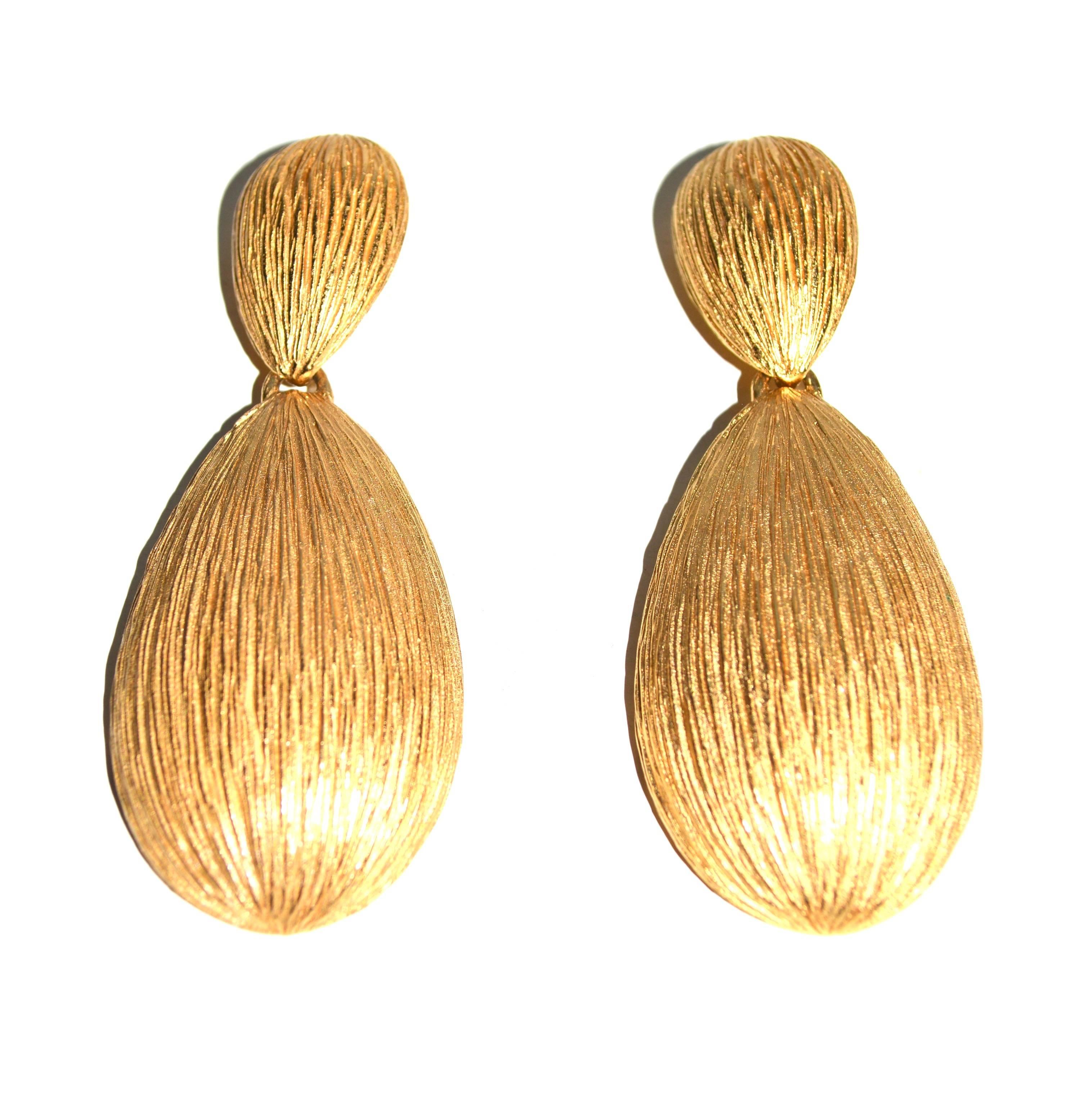 Circa 1980s signed Balenciaga stunning geometric etched metal earrings. From a French collection. The size is 3.5″ long by 1.5″ wide at the largest point. Width varies. Condition and gilt is excellent. 