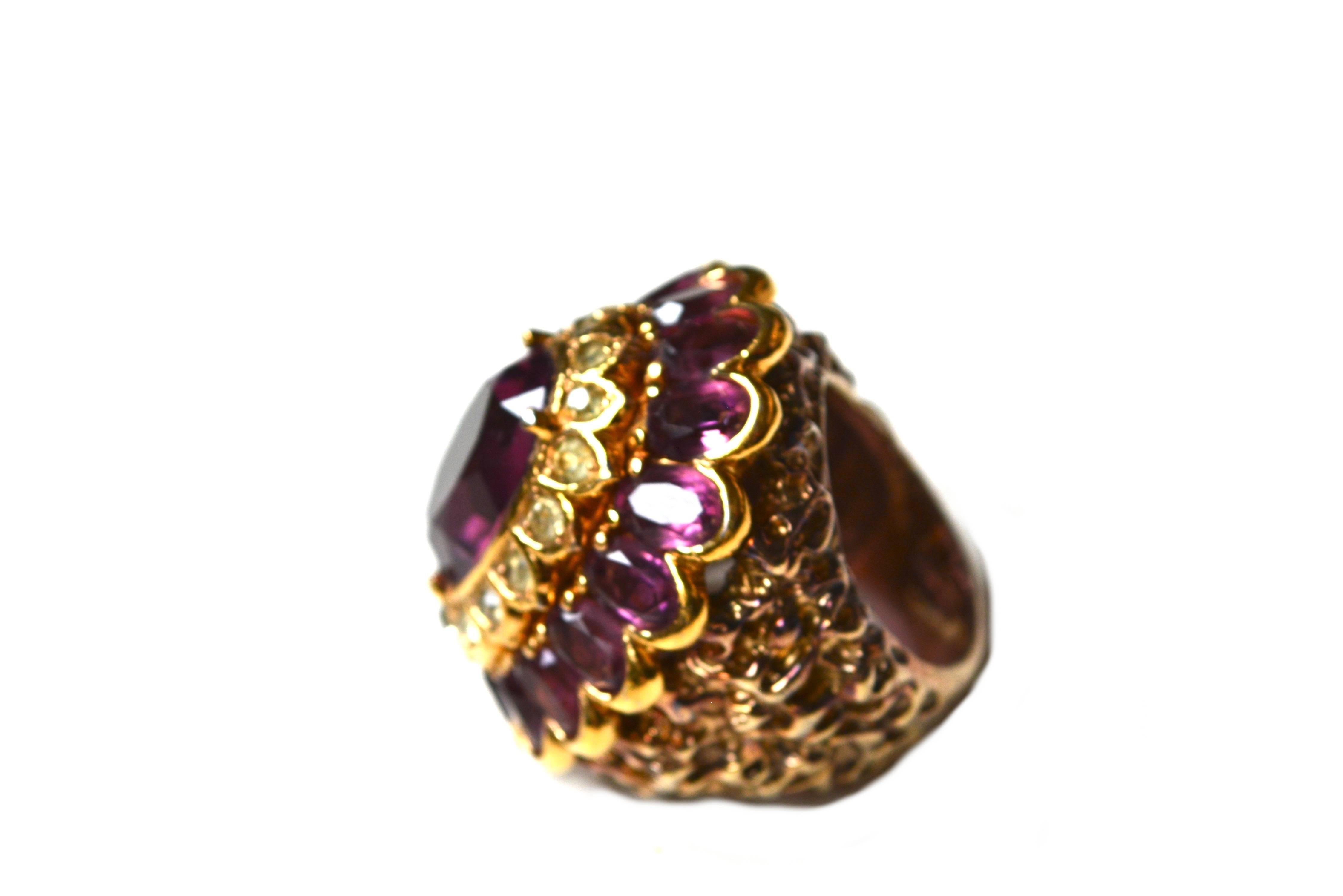 Large grape colored signed Panetta cocktail ring with nugget style textured band. Marked sterling with a golden finish. 1.75
