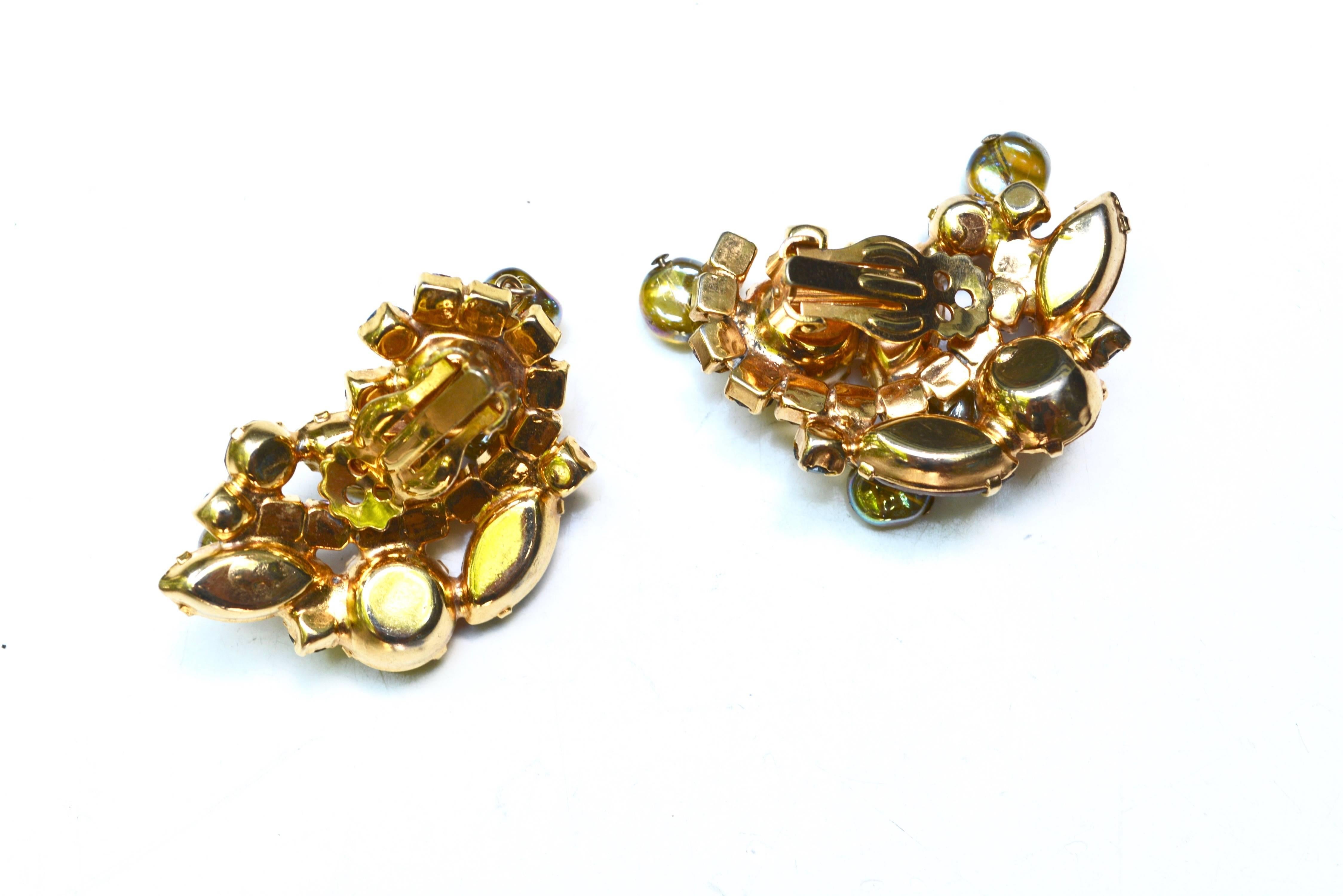 50s amber style glass stone clip on earrings with dangling beads and a bit of borealis finish. Unsigned, but they are quality in construction. 