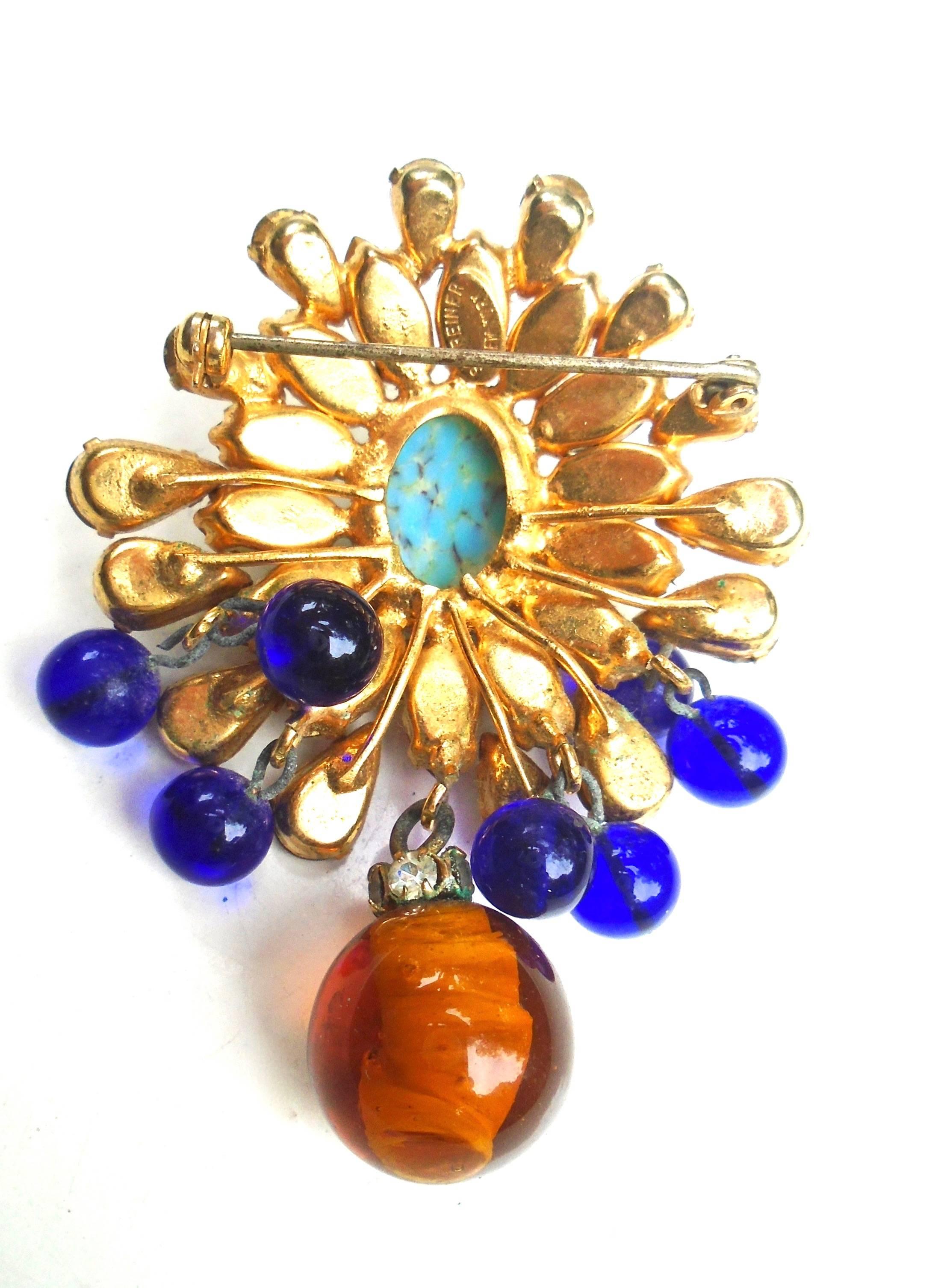 Lovely Schreiner brooch with a great mix of colors and glass beads.  The beads are in the style of Gripoix.  Wear and age to the metal connecting the droplets, but they appear thicker and sturdy. A bit of fogginess to a few stones. So the piece does