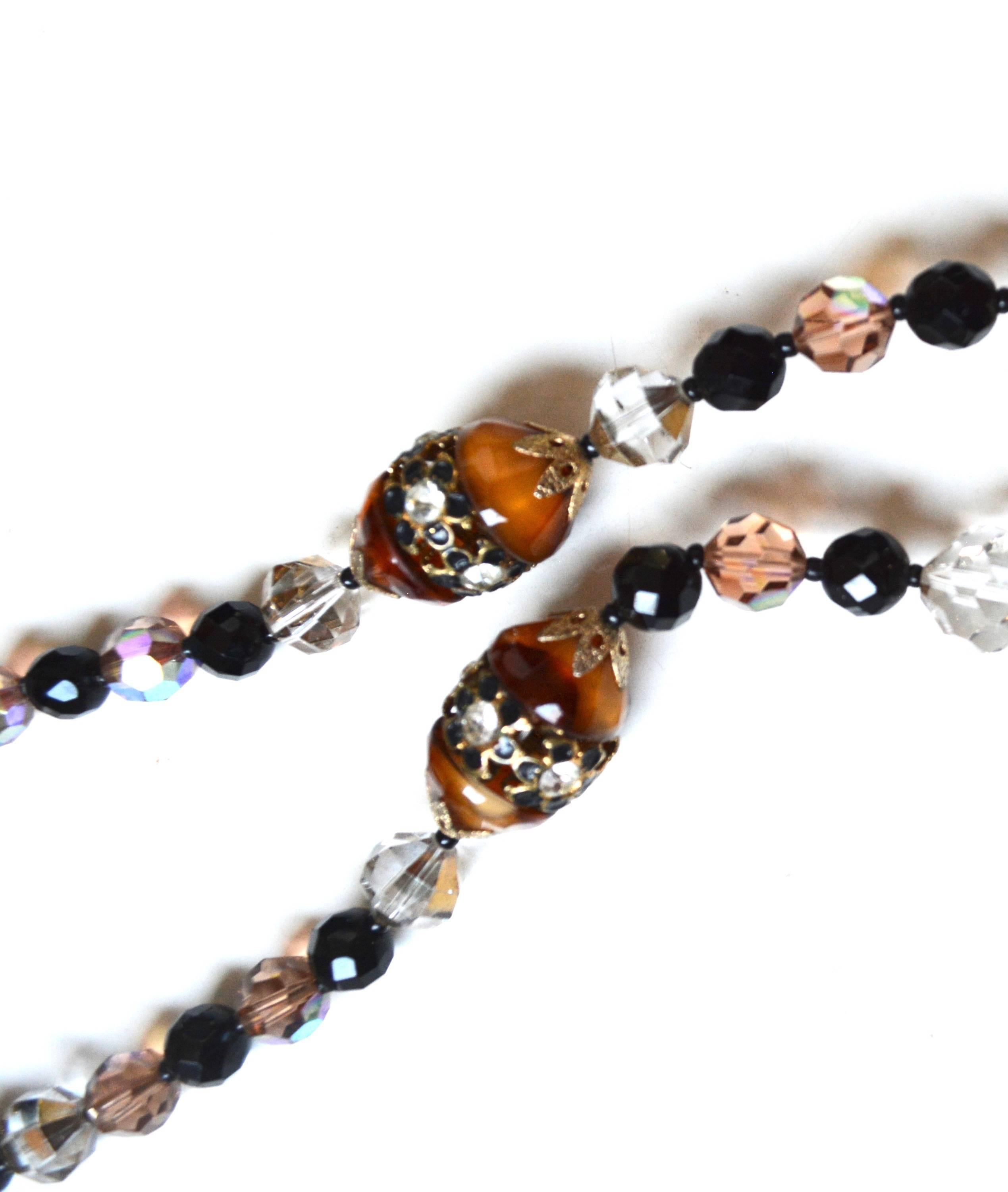 1960s signed Vendome glass bead necklace featuring various earth tones and black glass beads. The larger sort of amber glass beads are a nice color. Good condition with some wear to the clasp finish, which is now more of a matte finish.  A few tiny