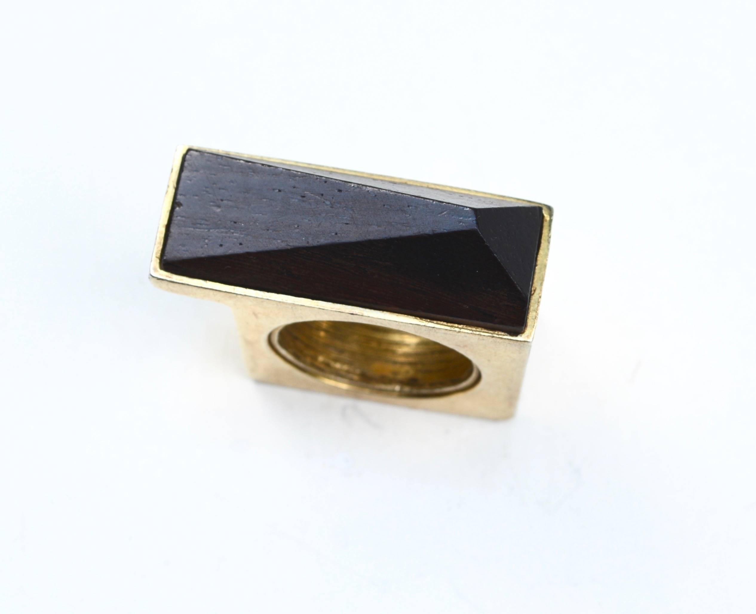 Modernist 1970s wooden sterling and gold wash ring in a larger size. Probably originally a man's. It fits my center finger. Size 8.5. Square section of the ring measures about 1.25
