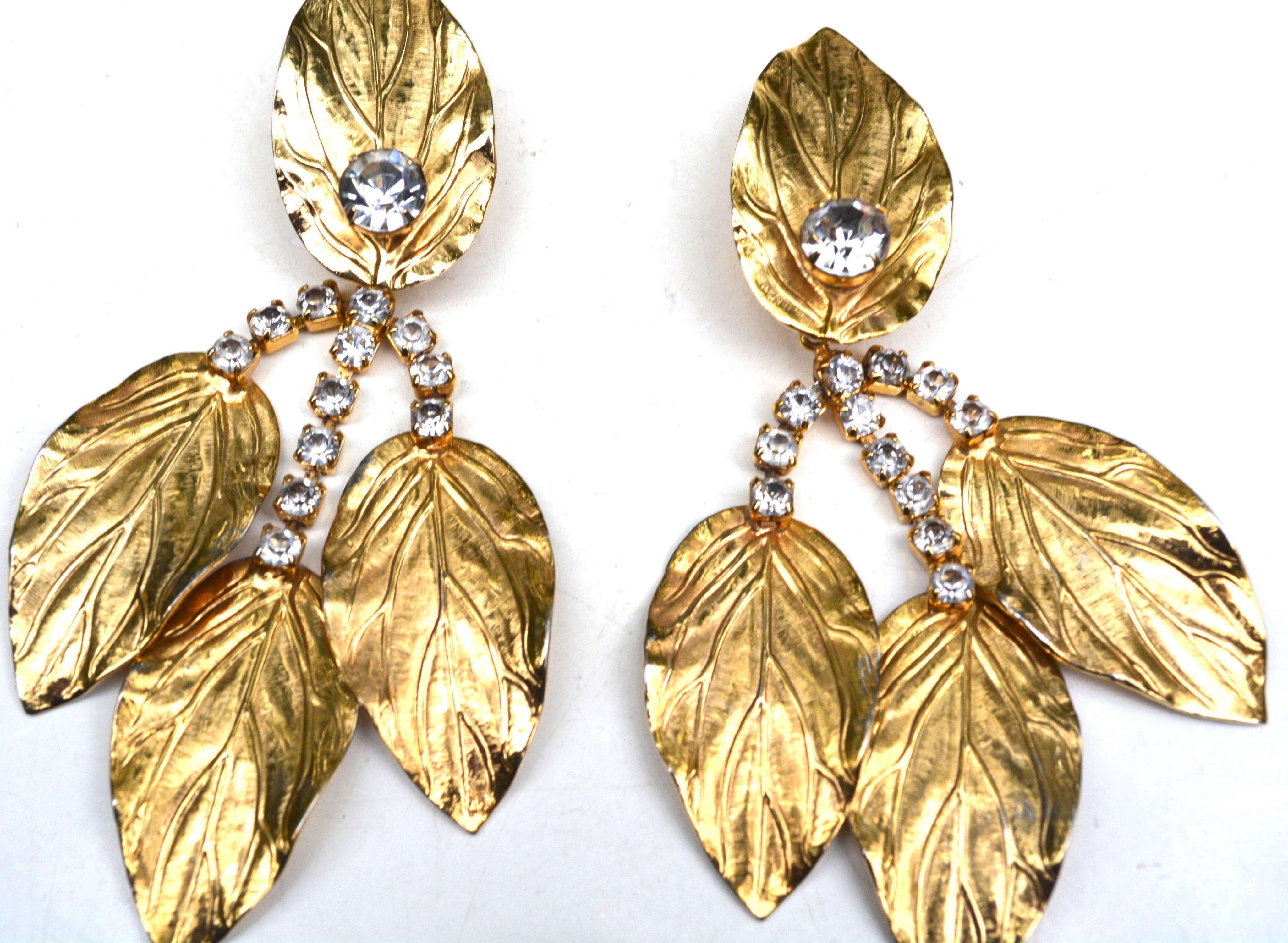 Signed oversized but well weighted golden leaf earrings by Kenneth Jay Lane. Condition is very good. Width varies. 