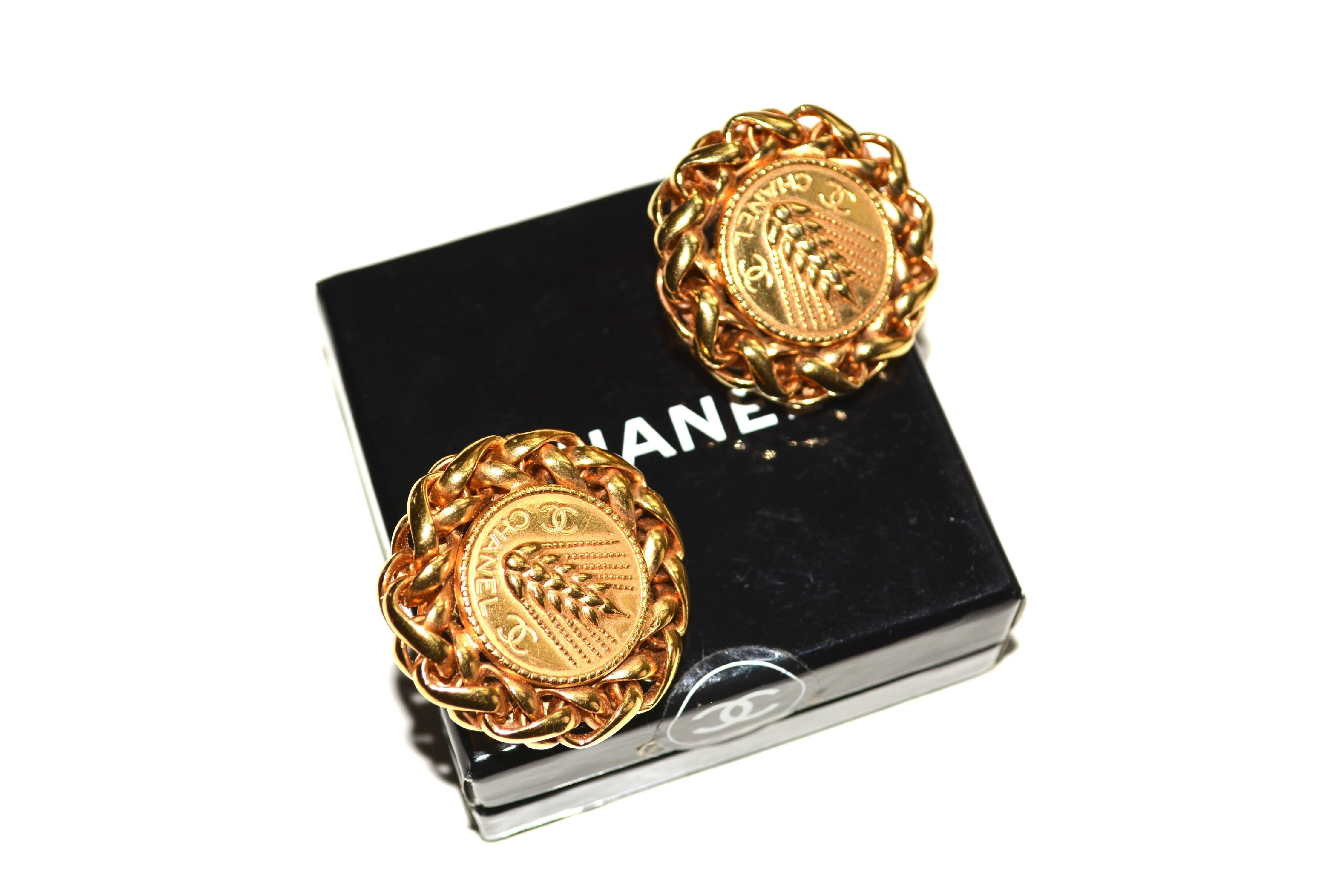 Lovely gilt larger wheat motif Chanel earrings. Signed with the simple Chanel signature dating these to most likely the 70s, this signature style was supposed to have been replaced by 1971.  However, it is possible it could be slightly later.  The