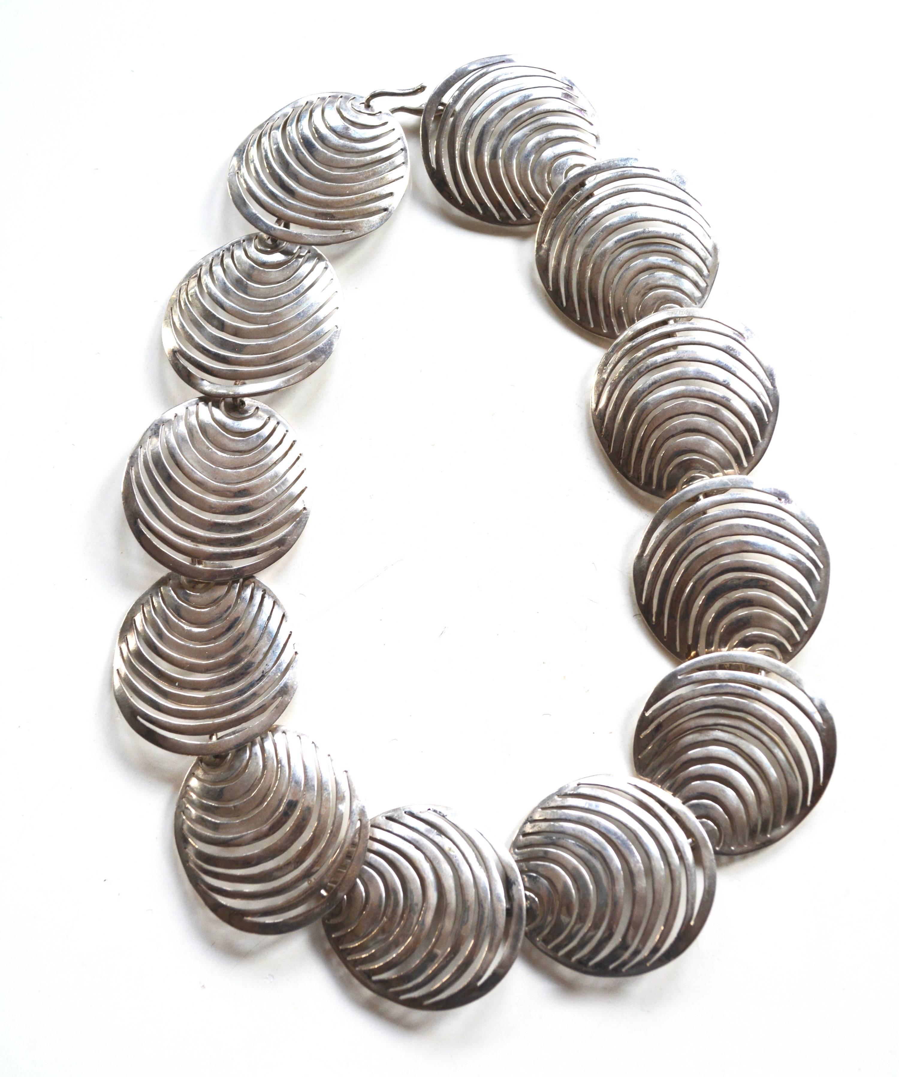 Vintage handmade 1970s sterling tested necklace. Features 1.5" wide abstract geometric links and simple hook closure. Total length is about 18.5" long. 