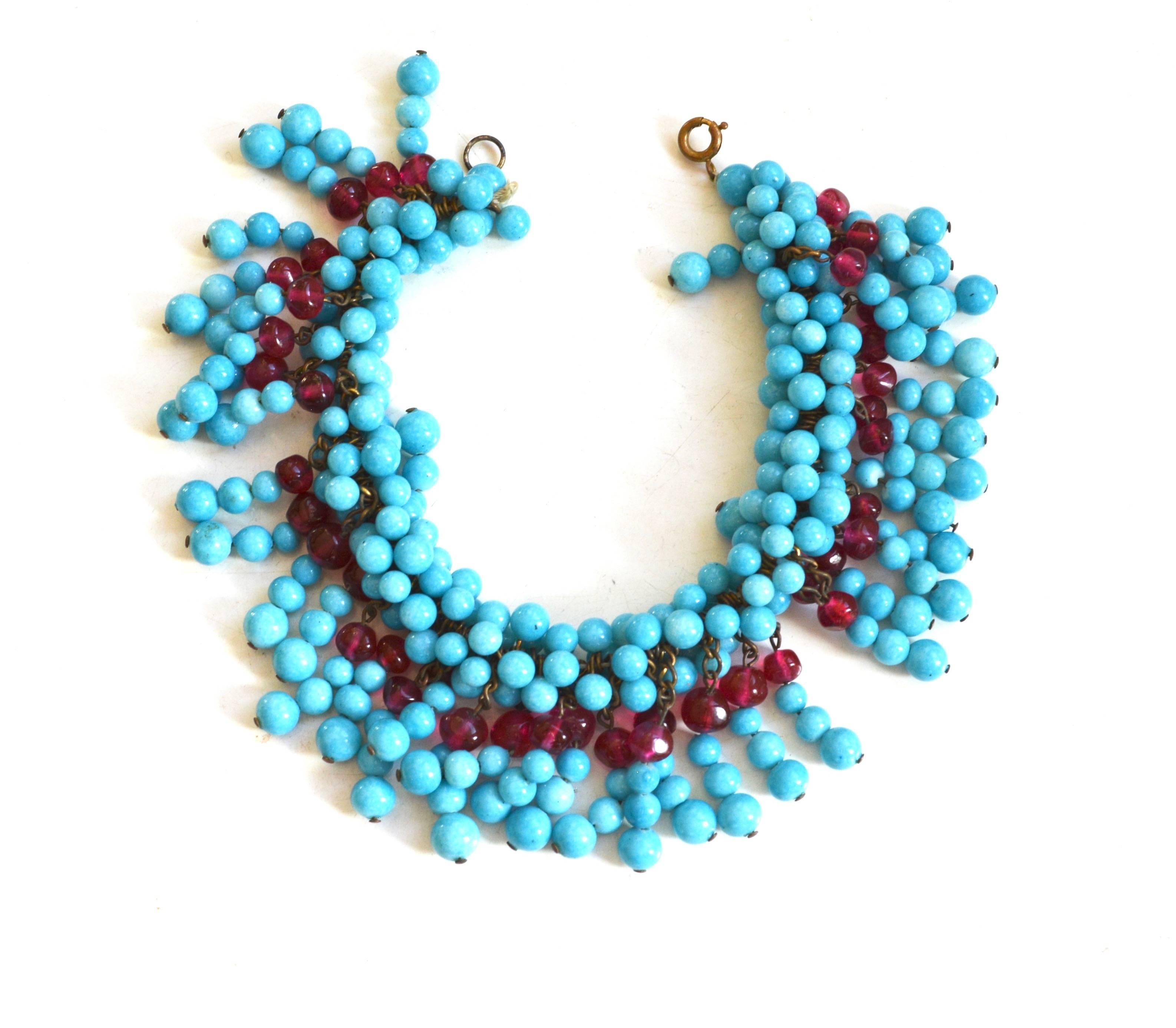 Gorgeous rare couture turquoise and berry Gripoix bead set. Marked France.  Circa 1940s hand strung on cotton with various links and chains. Such early Gripoix pieces were often beaded. Possibly for Chanel. Extremely unique lush look.  Condition is