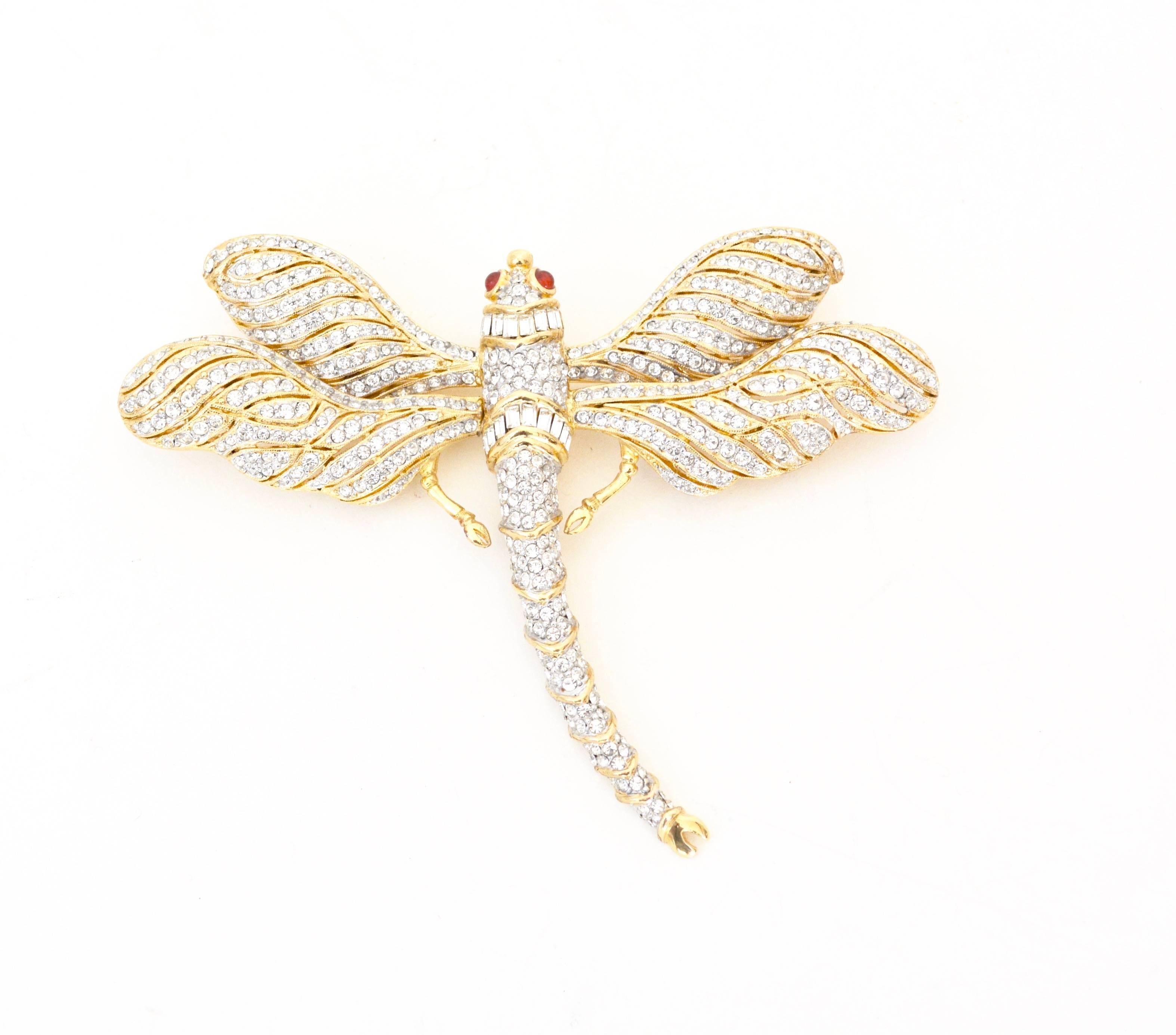 Fun large circa 1980s-1990s gilt rhinestone dragonfly signed Ciner. Features red glass cabochon eyes.  About 4" x 4.5" wide. Condition is excellent. Considering offers. 