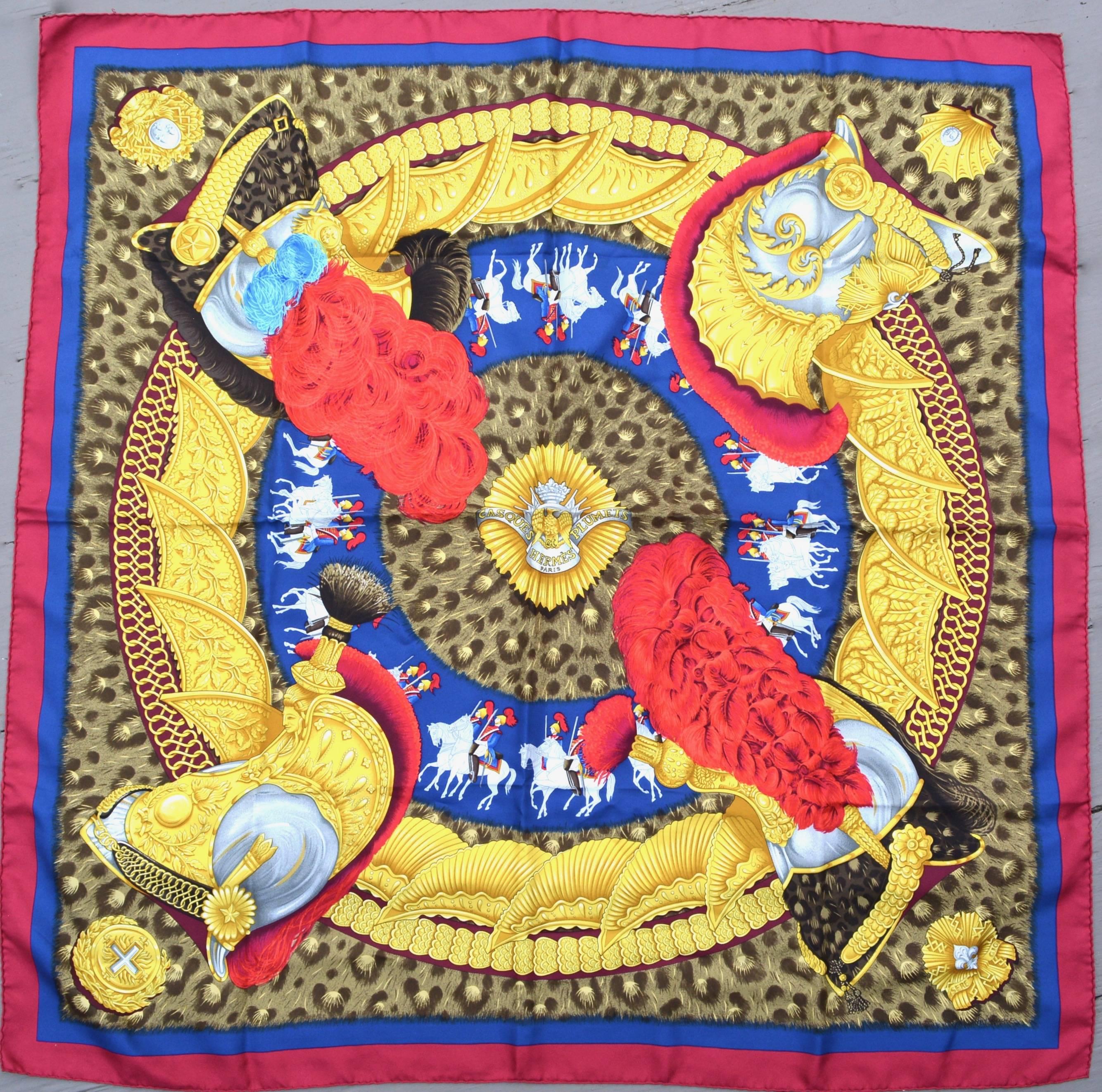 Gorgeous royal themed deep vibrant colored Casques Plumies silk scarf. Original silk screen design c1989 by Julia Abadie. This is vintage.  Hand rolled edges. 35" X 35". Excellent. Rare piece. Arrived just in time for a royal wedding!