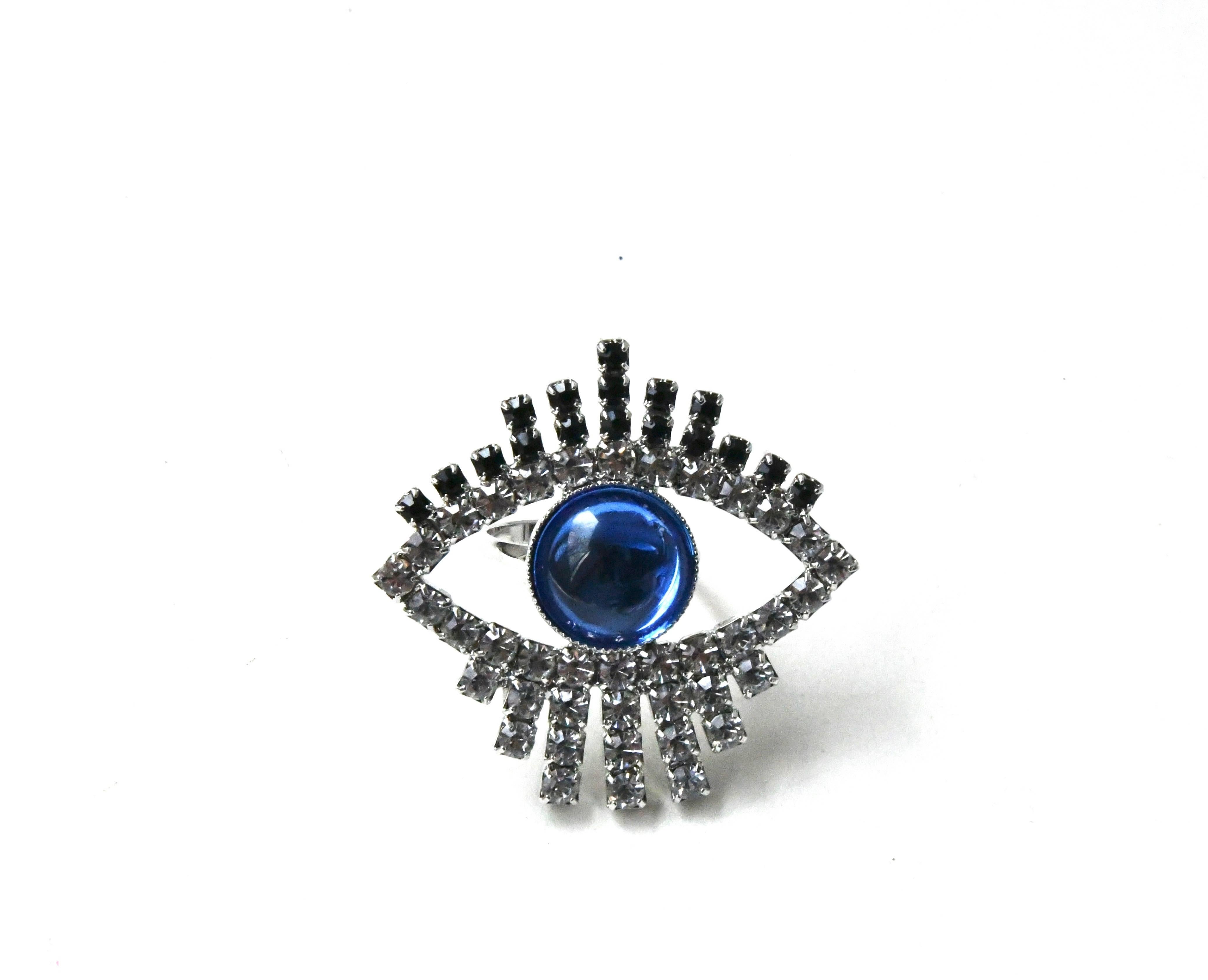 Gorgeous hand made Swarovski crystal ring with rhodium plating, made and designed in the U.S.A. Adjustable with hidden adjuster under the eye. Measures about 1.5″ wide. Price for one listed blue ring. Available in green, purple, yellow, blue, and