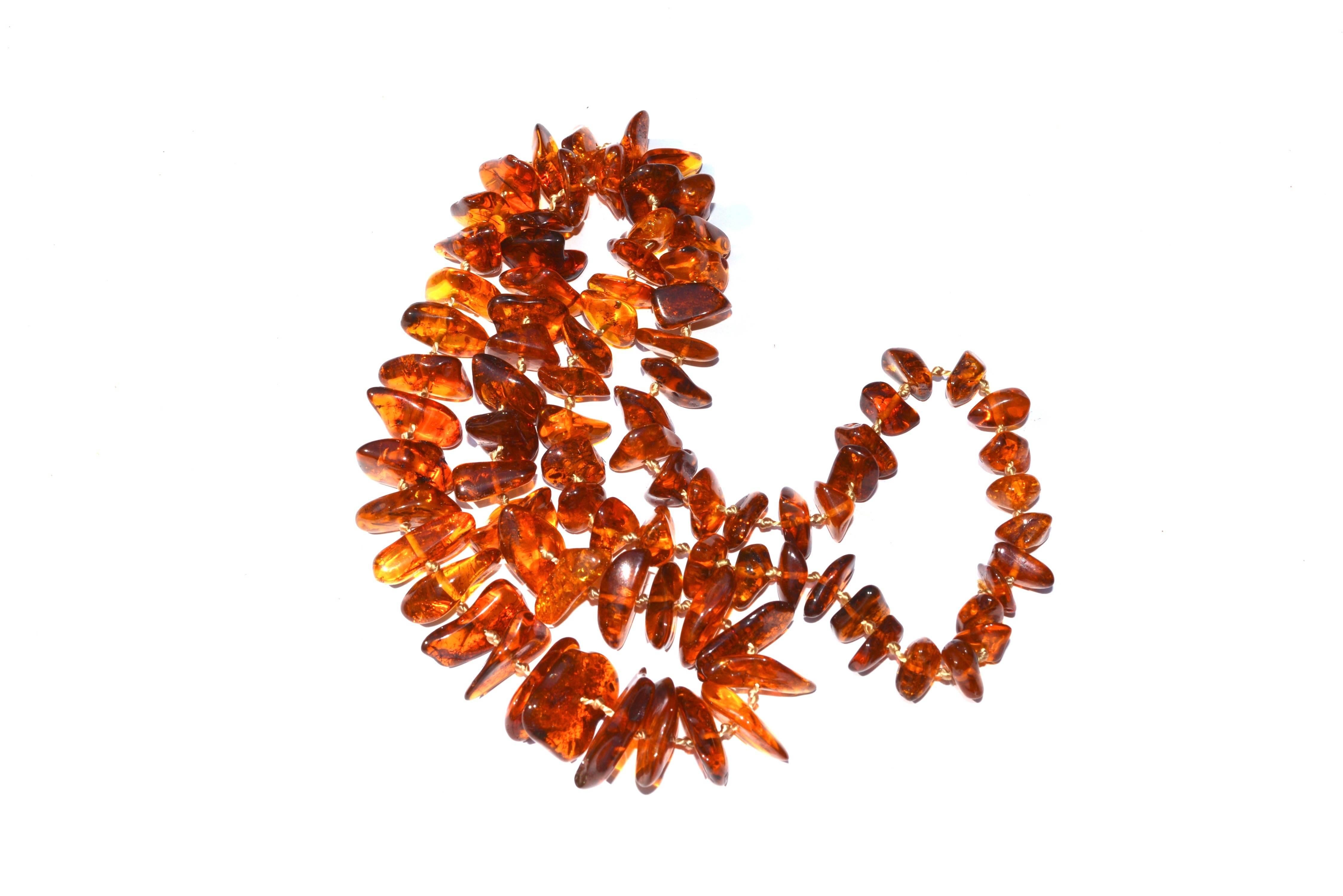 Hand knotted amber nugget necklace. 28