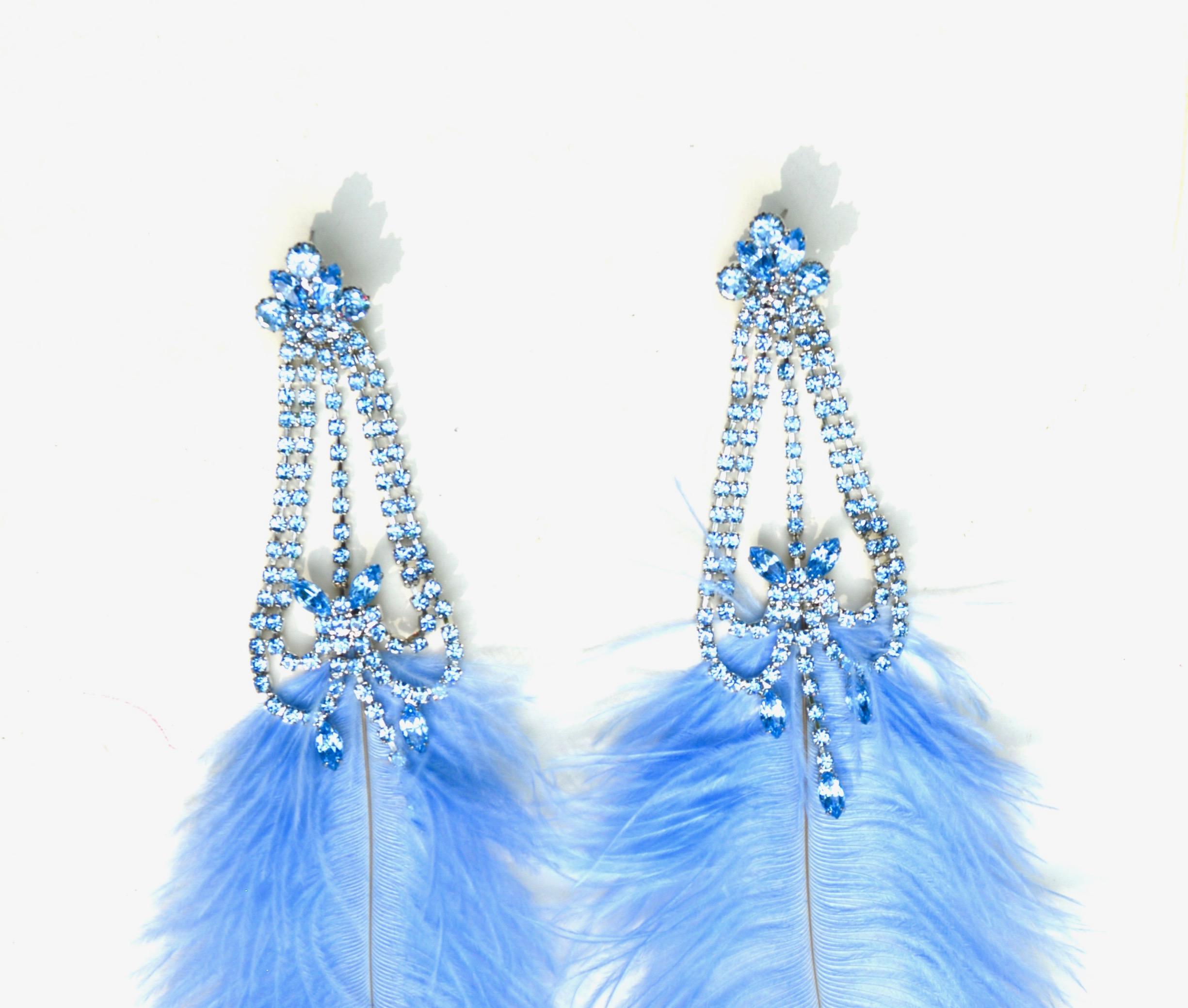 Designed by Sara of Sarara Couture, the new line has been featured in magazines and on celebrities. Made by hand in the USA.  Swarovski stones and cruelty free Ostrich shed feathers.  Wearable weight.  Feathers dip over 7