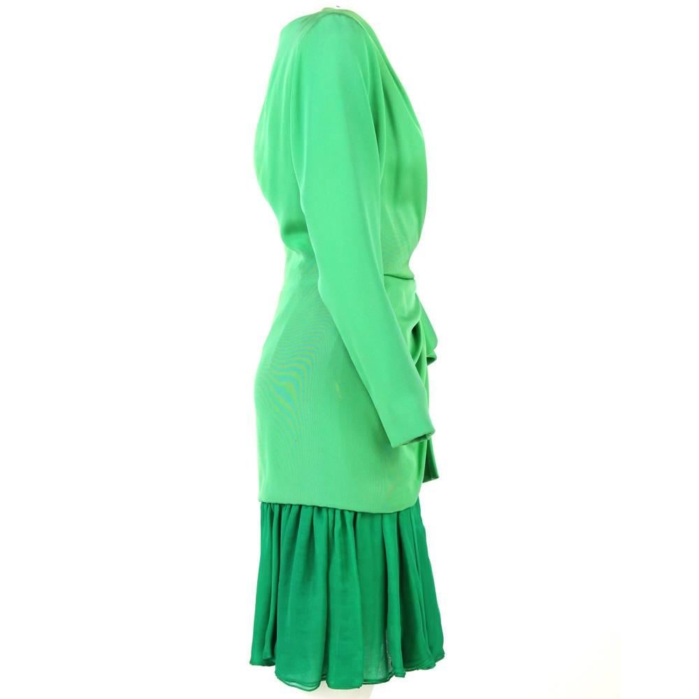 Classy emerald and mint green long-sleeved wrap dress by the haute couture designer Andrea Odicini. From the 1980s, this bright dress is made of 100% silk and has a clean v-neckline and a soft, fresh pleated skirt. The waistline is highlighted by