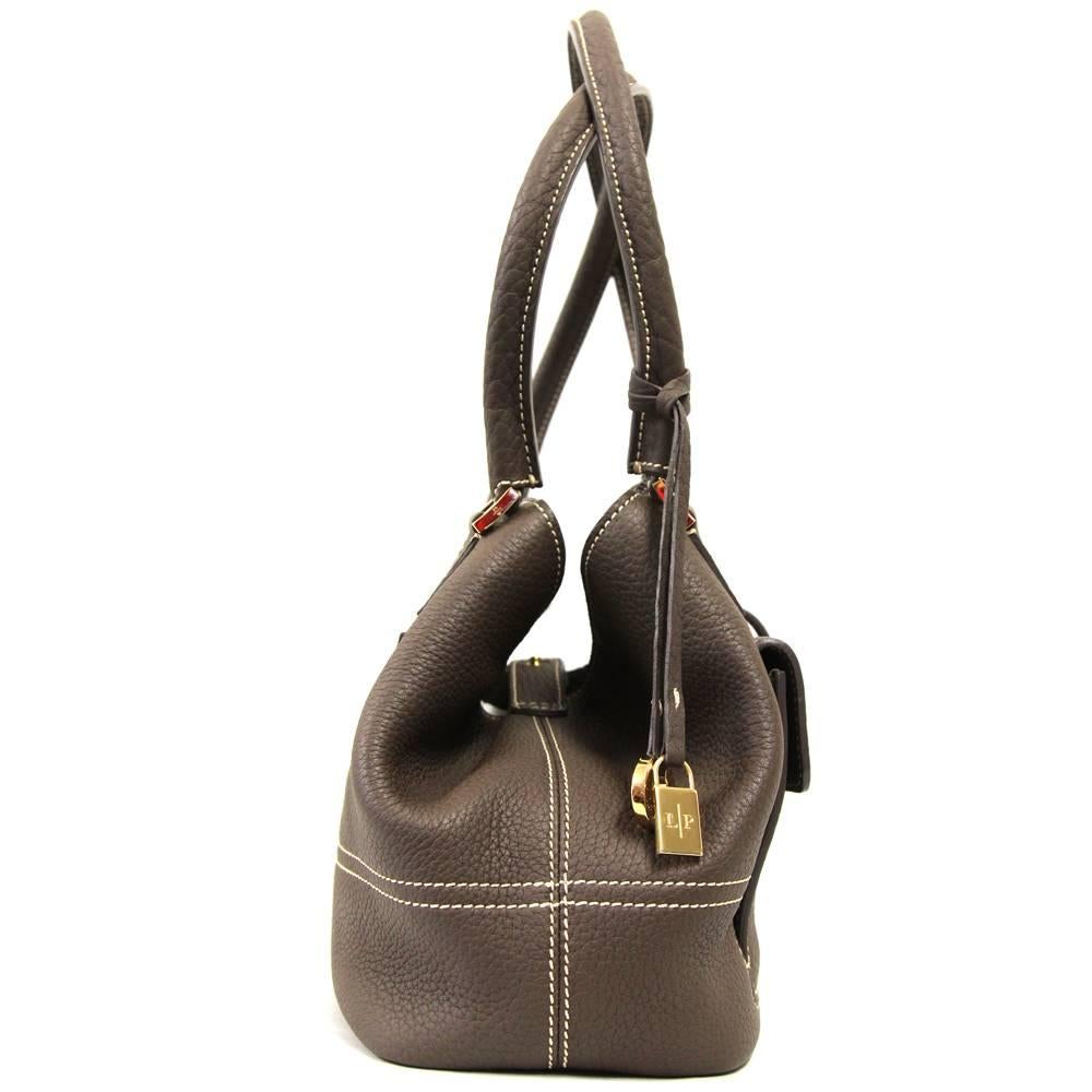 Essentially glamorous Loro Piana tote bag in soft brown leather from the 2000s. Features one inside compartment with one zip pocket and three applied pockets; one applied pocket and one zip pocket on the outside. Press-stud closure and monogram